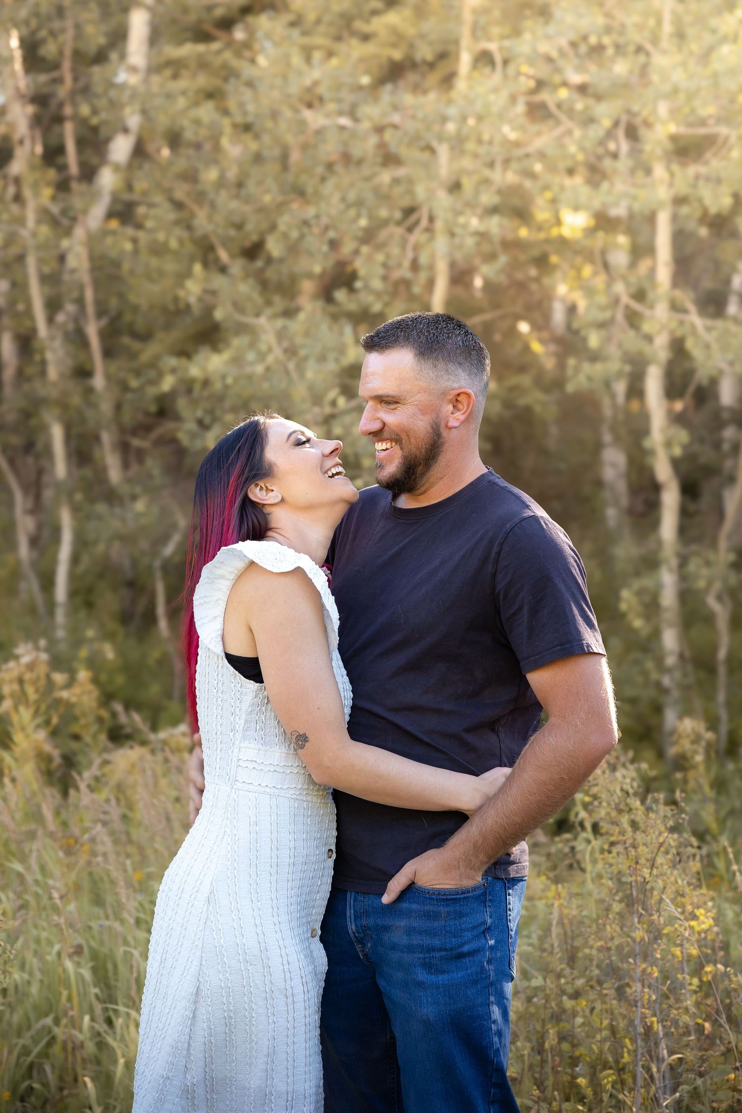 Romantic couple sharing intimate moment in natural outdoor setting.