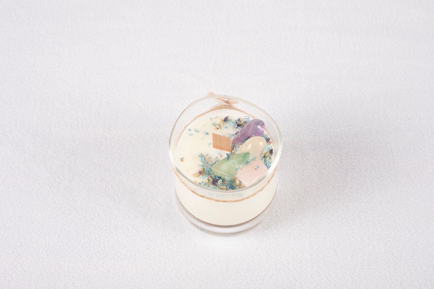 Elegant white ceramic dishes with soft pastel accents on a light background.