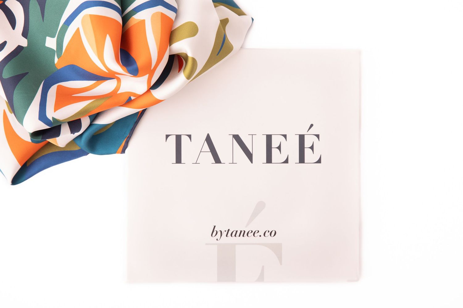 Abstract floral design elements in orange, teal and beige colors with Tanee branding text overlay.