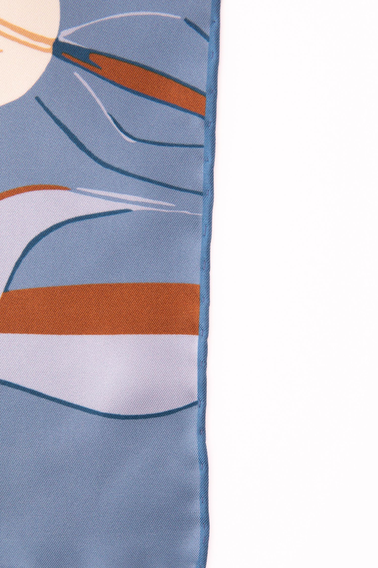 Abstract blue and orange geometric pattern with curved shapes and lines on a light background.