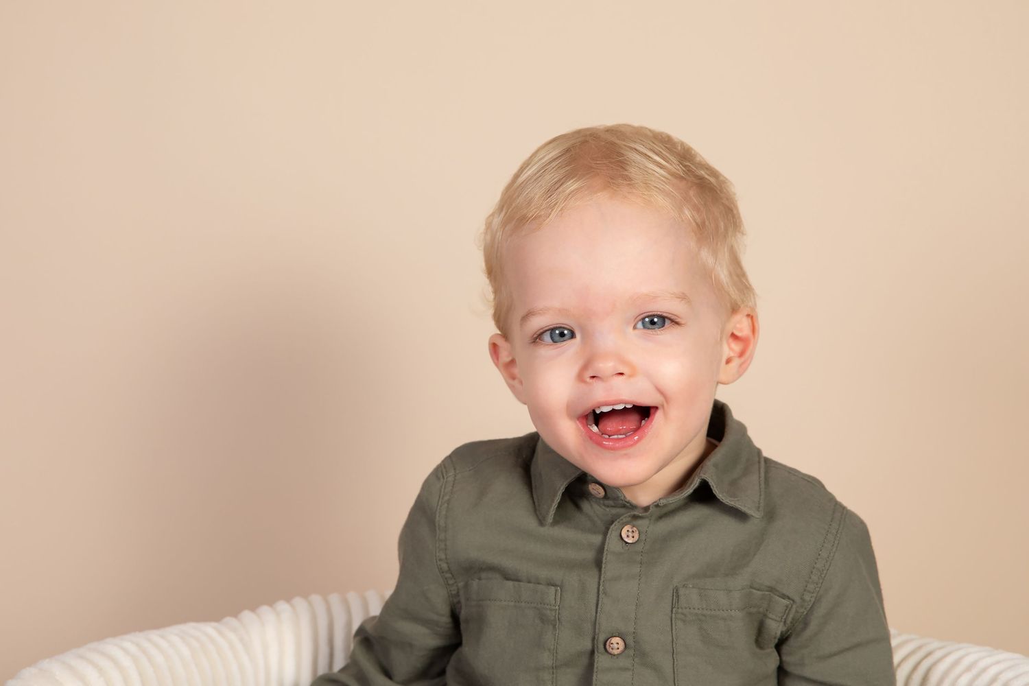 Candid studio photography session capturing natural smiles and genuine emotions.