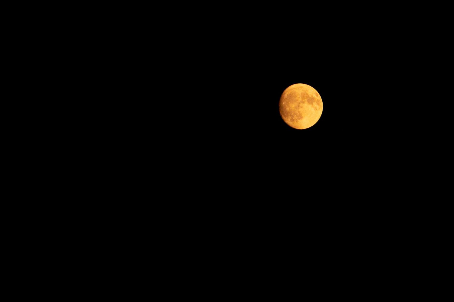 Sequence showing full moon phases against dark night sky.
