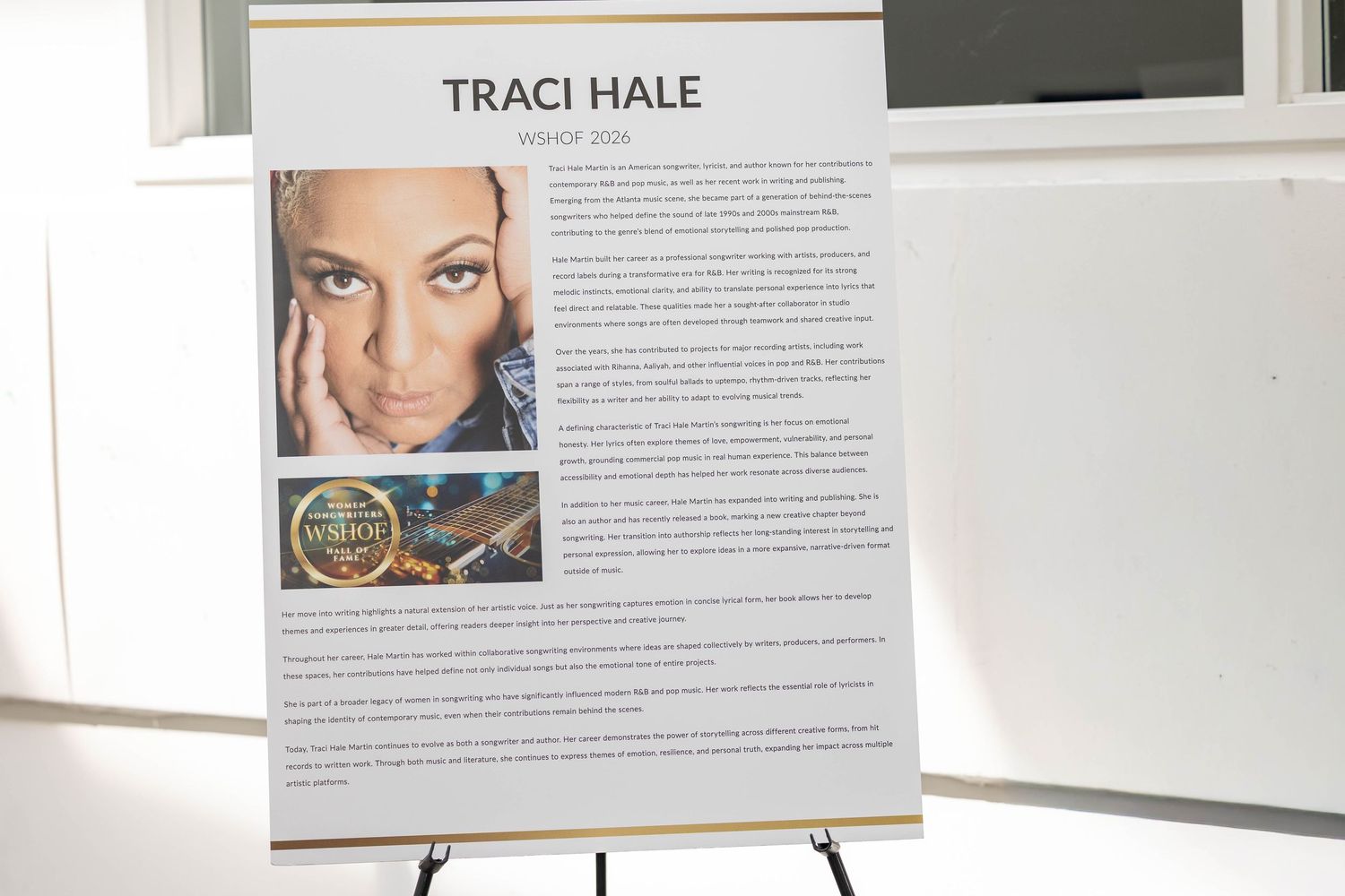 A display board on an easel featuring Traci Hale NSHOF 2016 inductee biography and photo at an awards event.