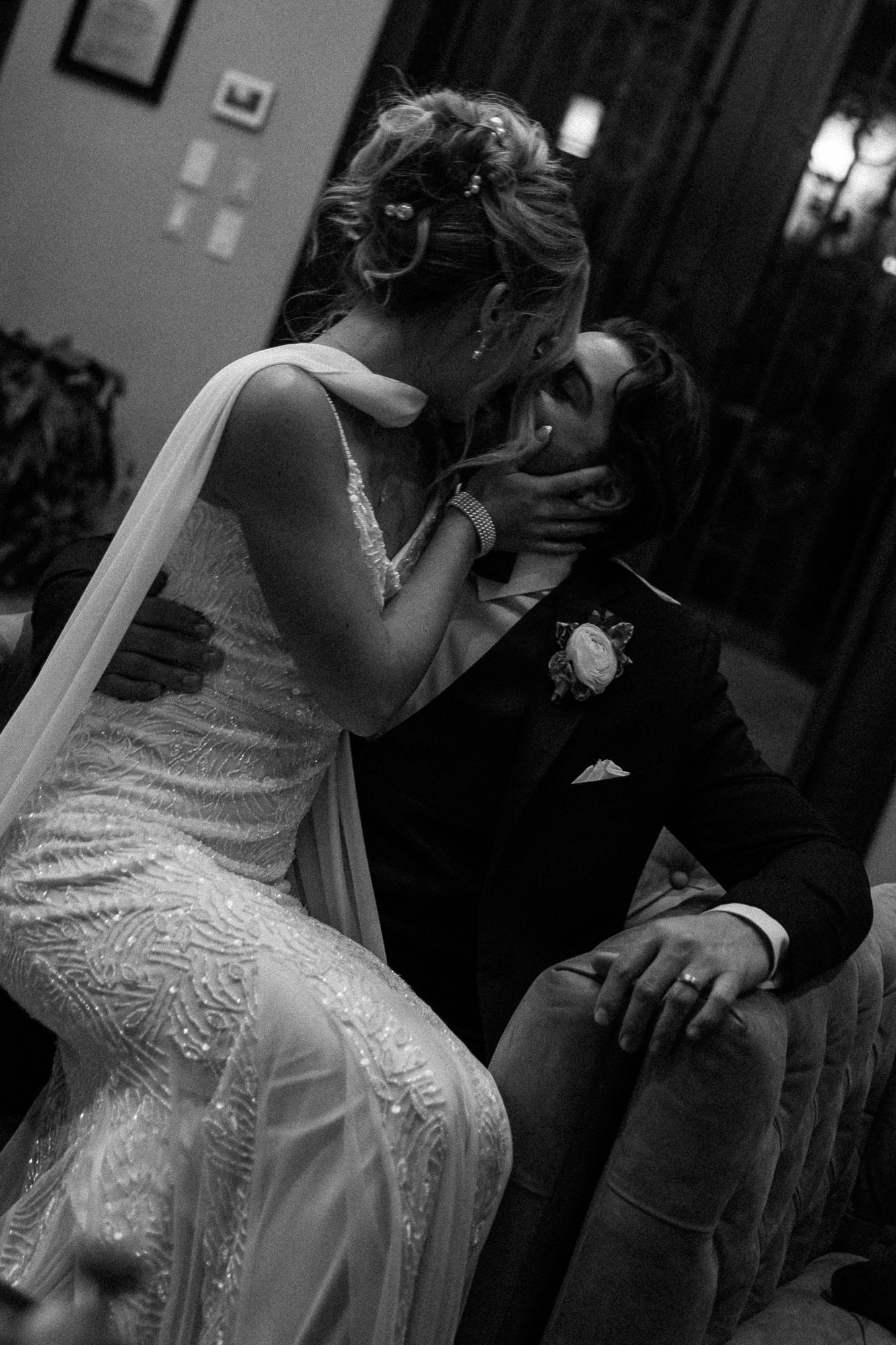 A romantic black and white photo series showing a couple in formal attire dancing closely together at an event.