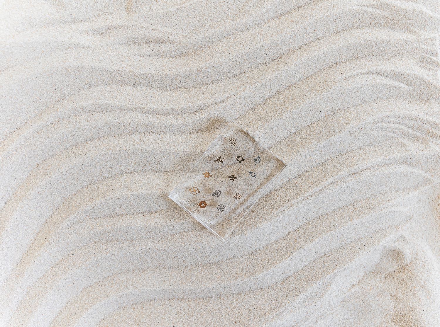 Smooth wavy pattern of light beige sand with soft ripples creating a natural abstract texture in desert landscape. arizona sand studio