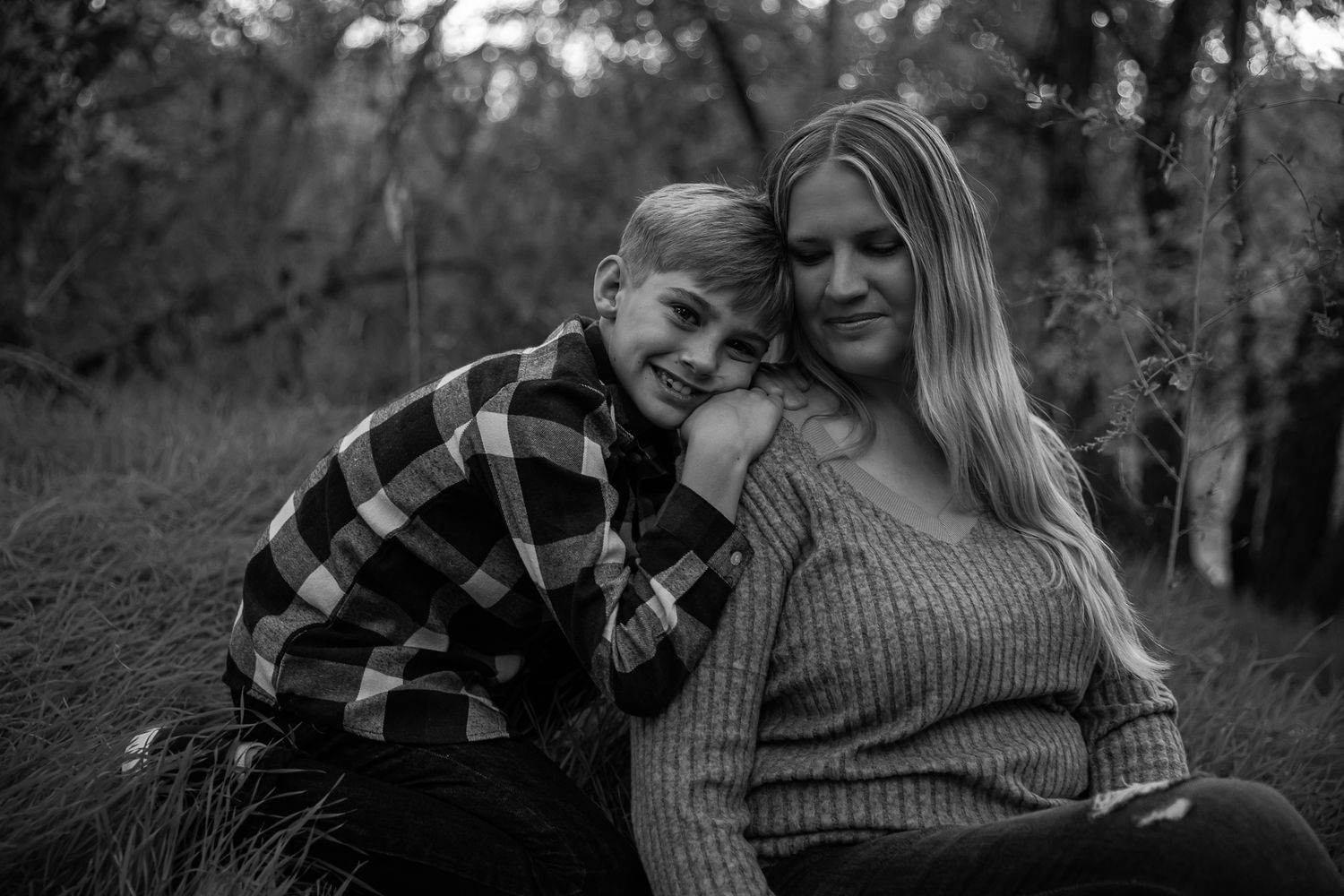 Intimate black and white family portrait session in a natural outdoor setting. arizona field by the river