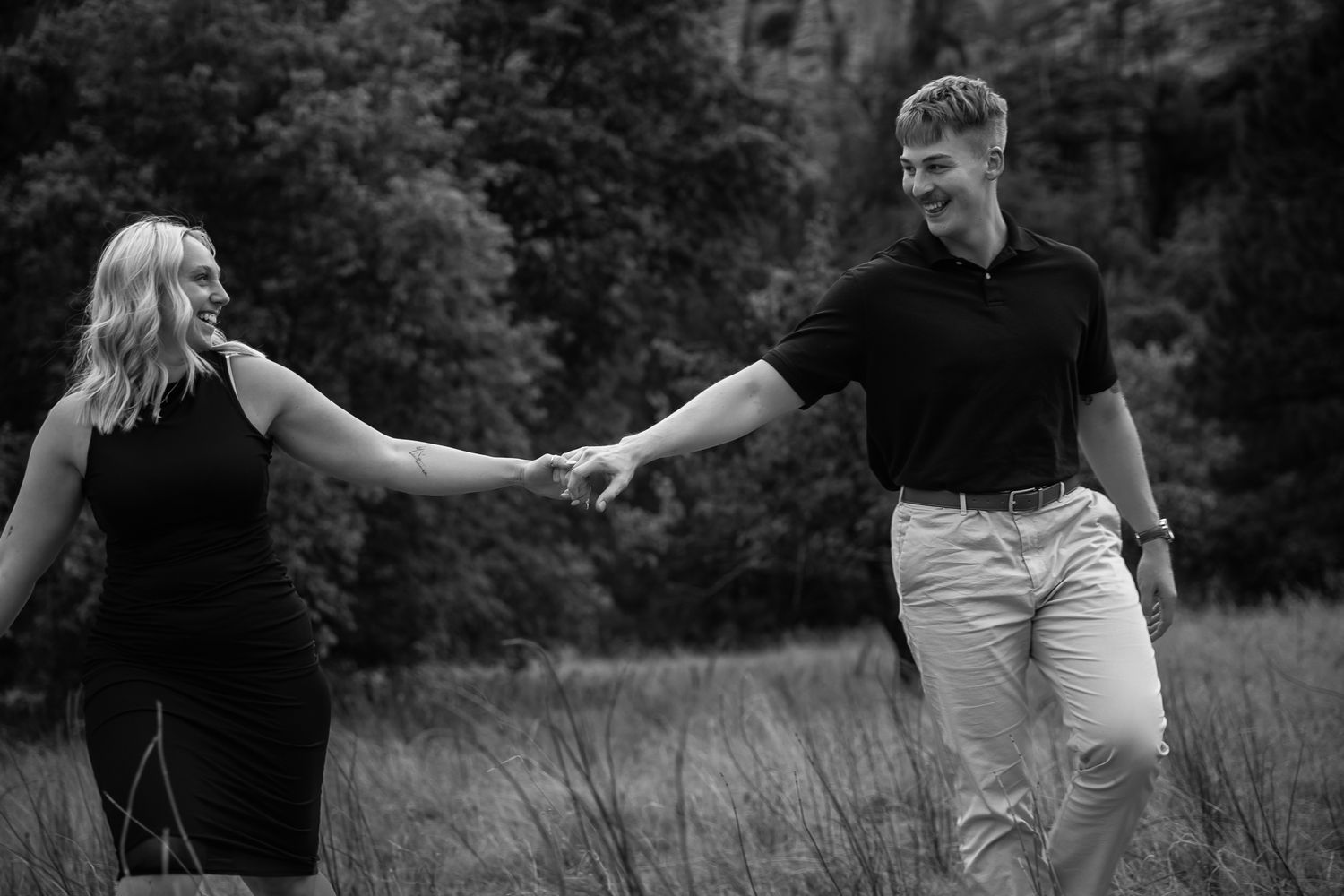 Black and white outdoor sequence showing playful interaction in a field.
