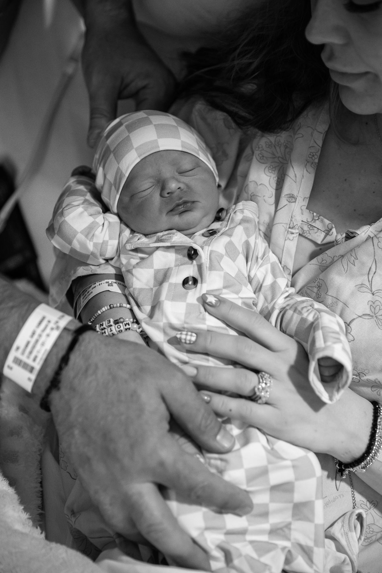 arizona birth photographer. Black and white photo sequence showing a newborn baby's first moments after birth in a hospital setting.