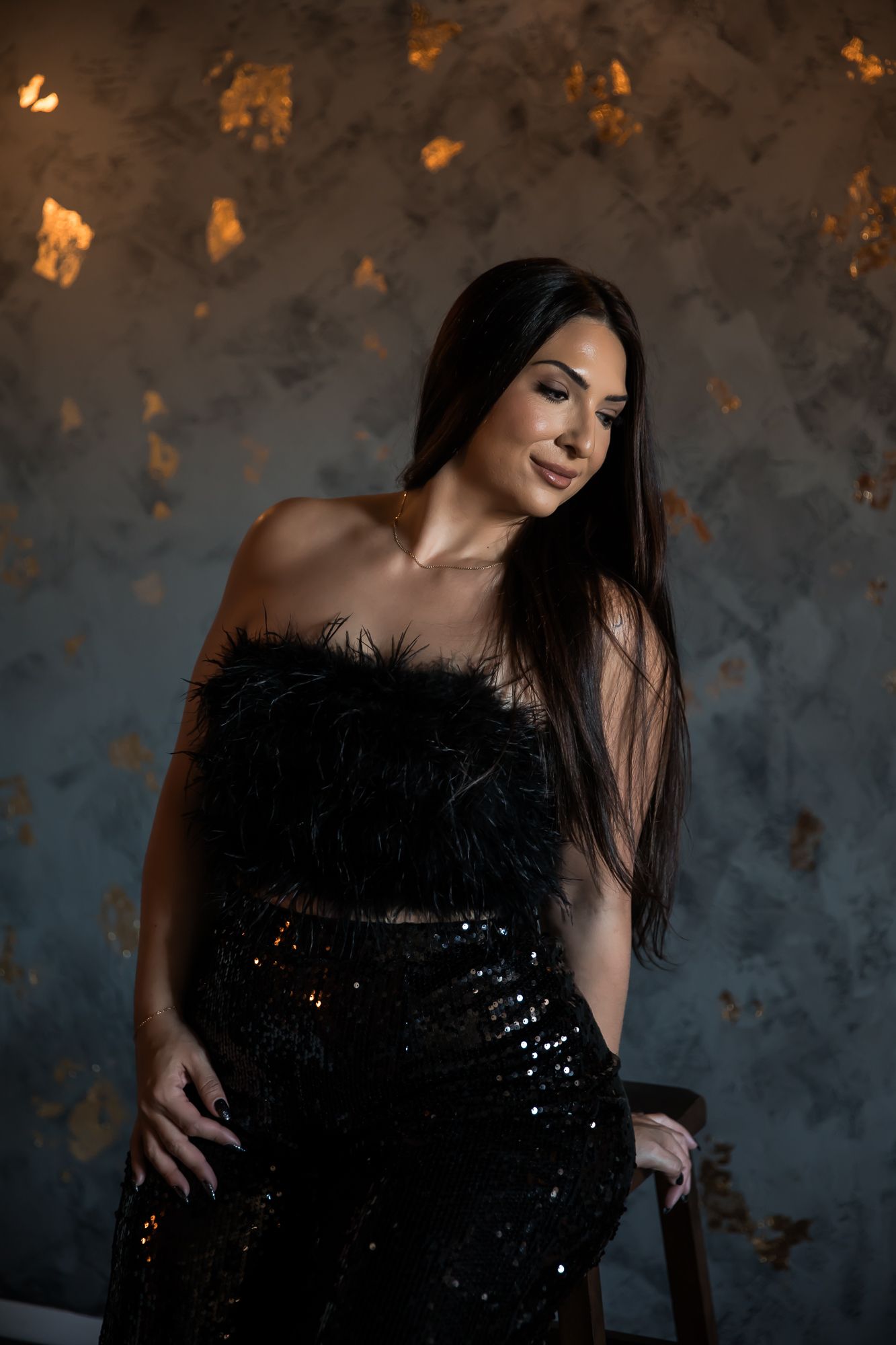 Glamour portrait series featuring sparkly black dress against textured backdrop. arizona studio