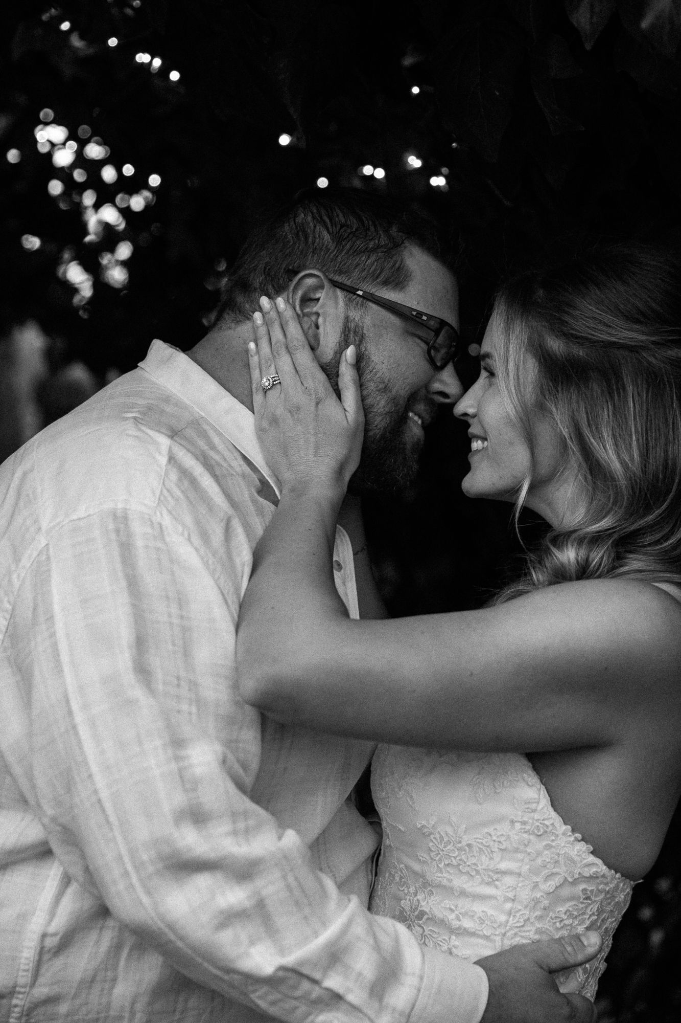 Romantic wedding dance sequence captured under twinkling lights at night.