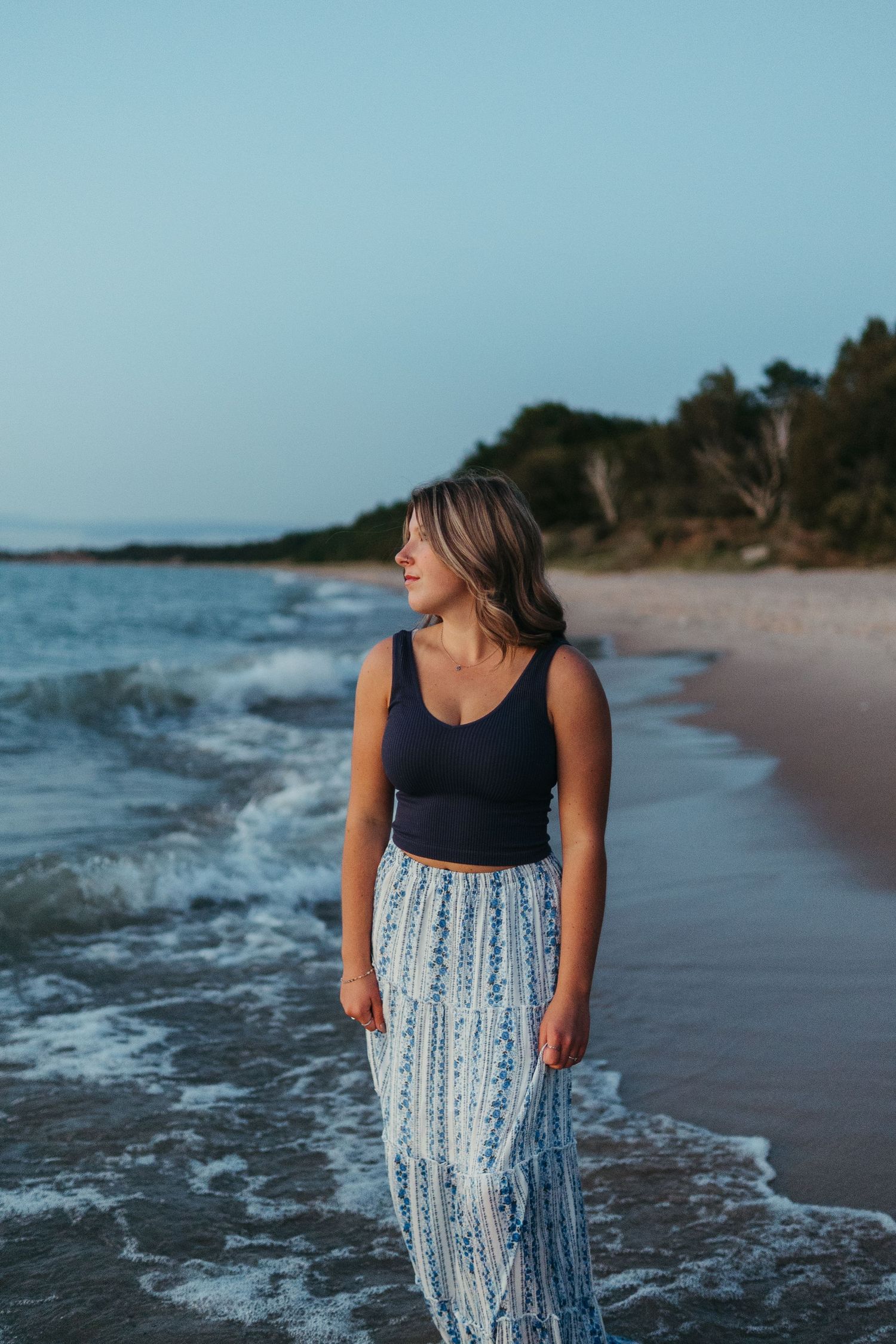 “Individual portrait session on Northern Michigan beach, captured with warm, timeless style”