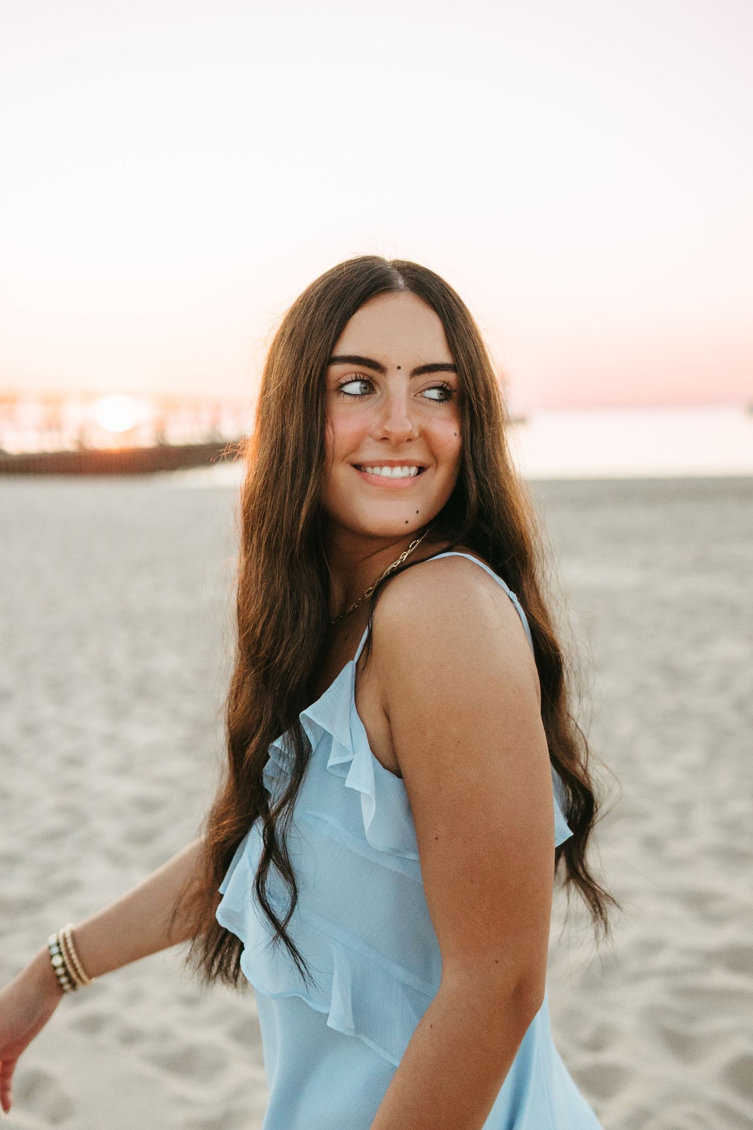 “Close-up portrait of a person laughing naturally, captured with authentic, heartfelt imagery”