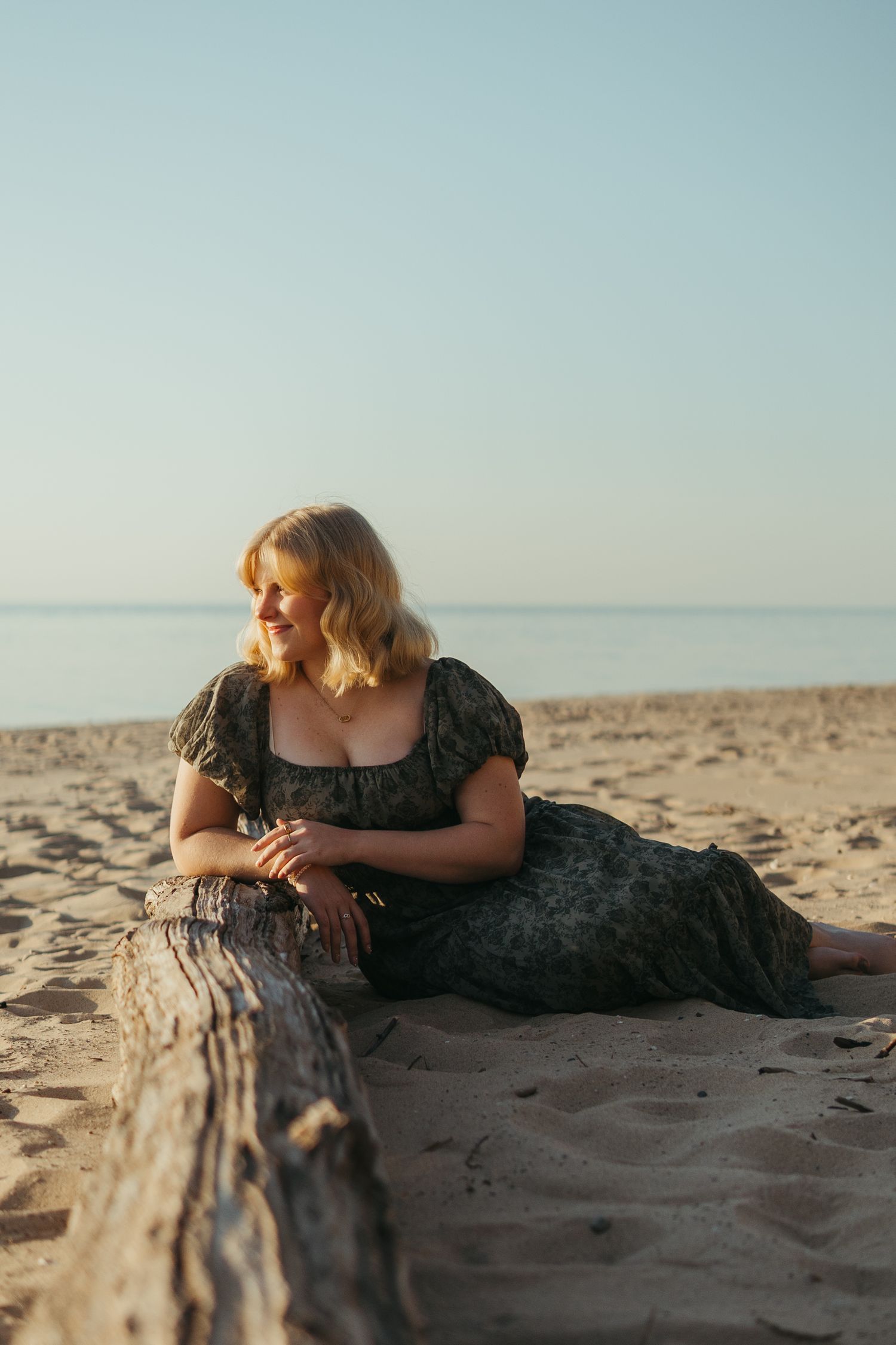 “Individual portrait session on Northern Michigan beach, captured with warm, timeless style”