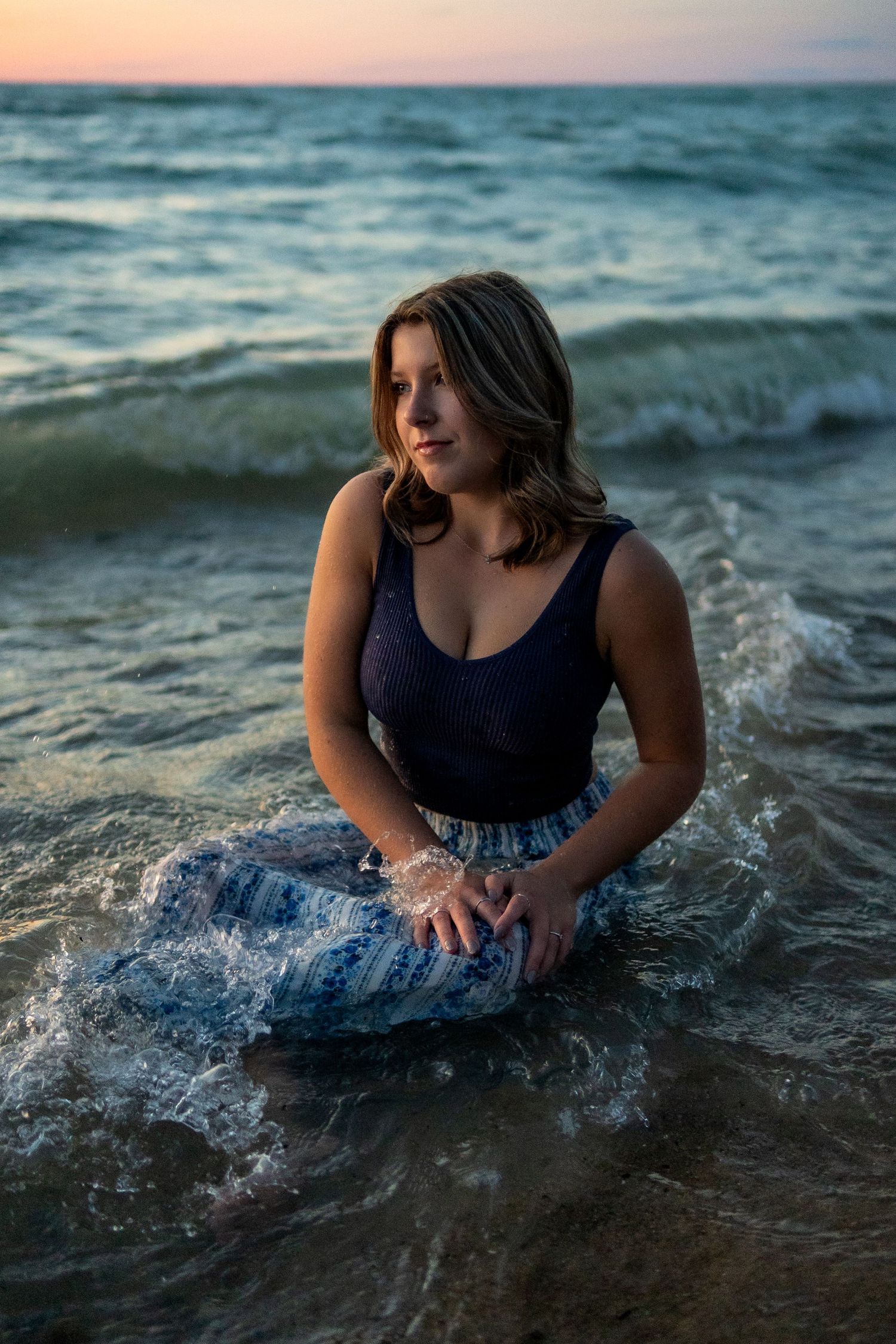 “Individual portrait session on Northern Michigan beach, captured with warm, timeless style”