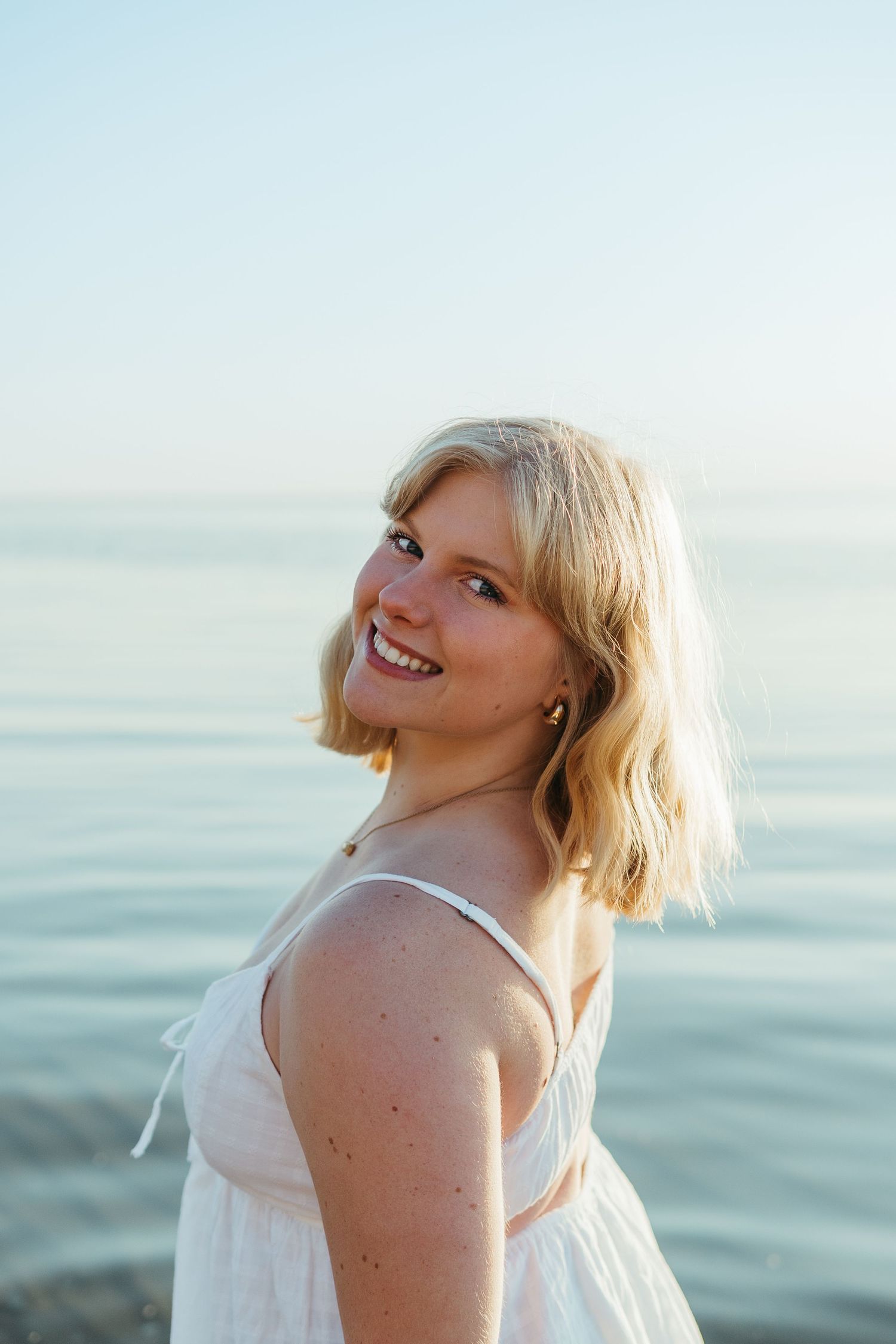 “Close-up portrait of a person laughing naturally, captured with authentic, heartfelt imagery”