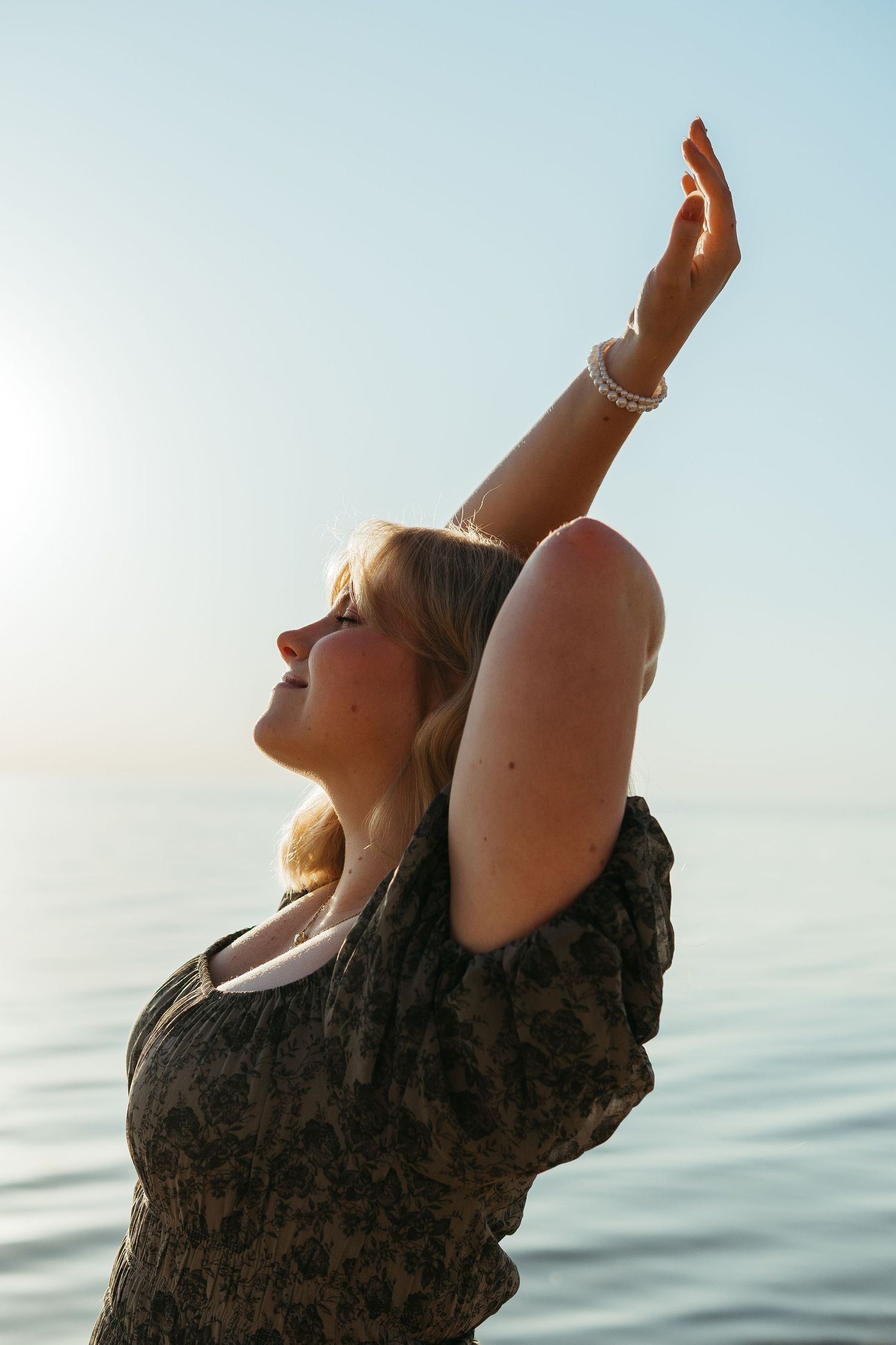 “Individual portrait session on Northern Michigan beach, captured with warm, timeless style”