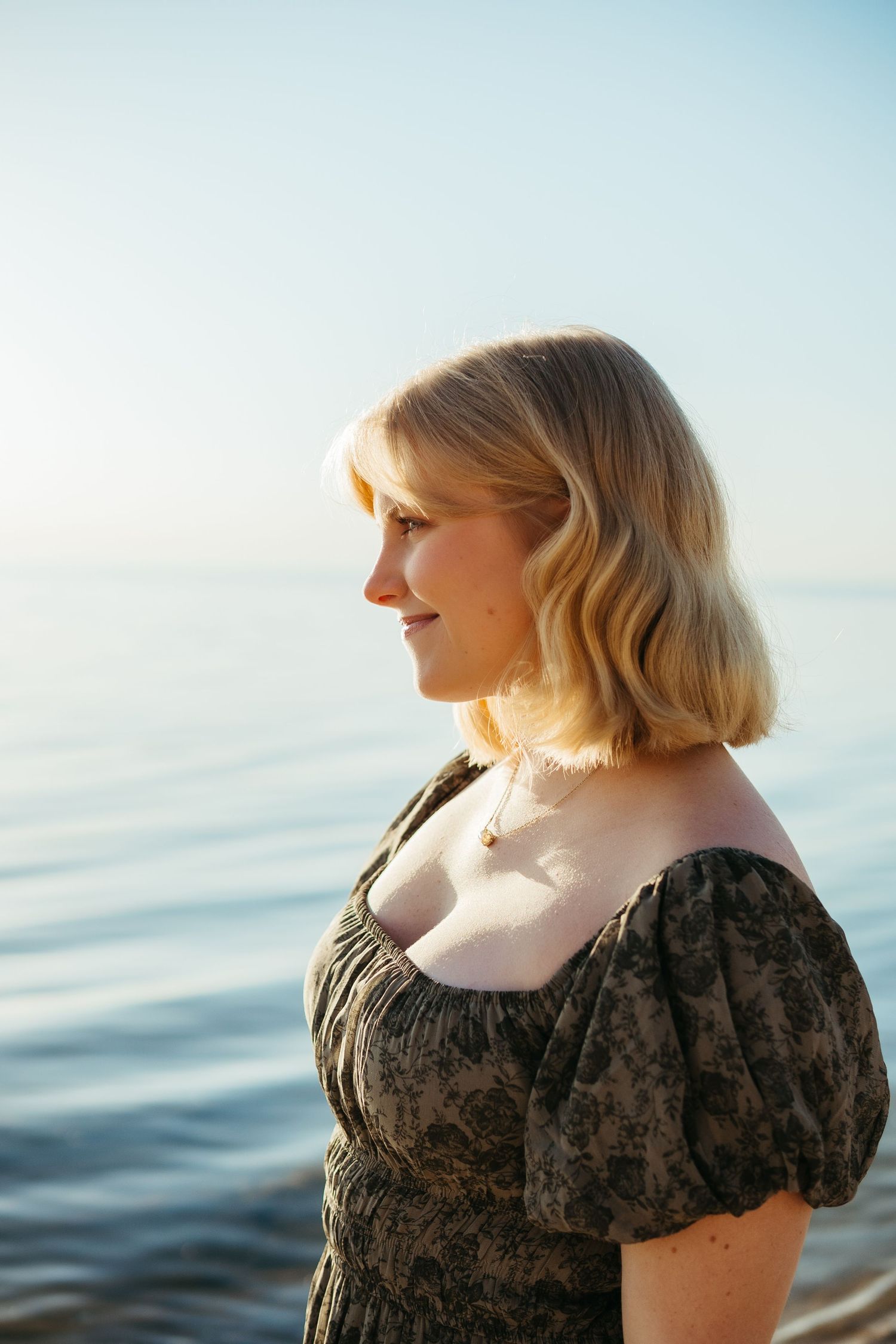 “Individual portrait session on Northern Michigan beach, captured with warm, timeless style”