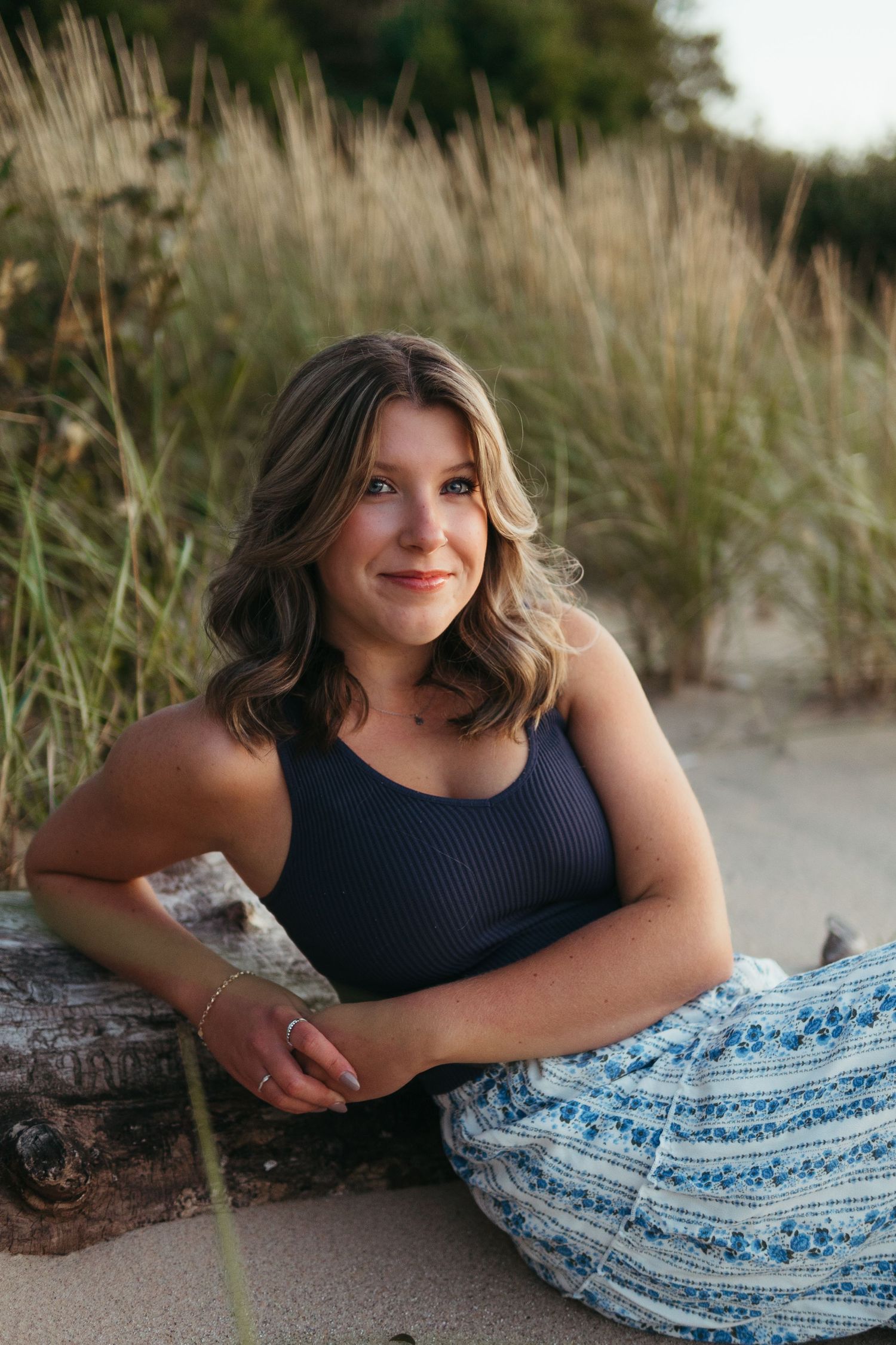 “Individual portrait session on Northern Michigan beach, captured with warm, timeless style”