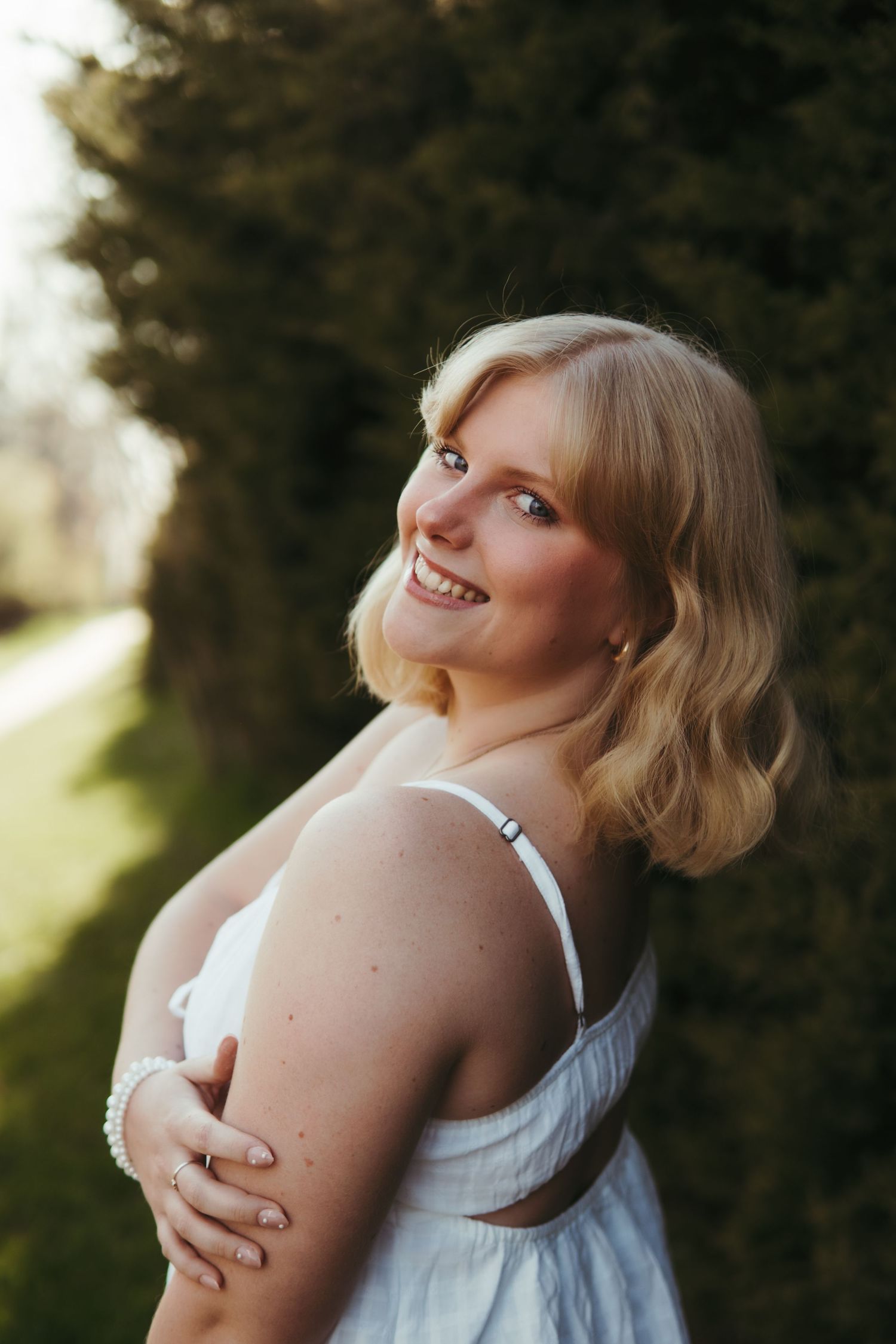 “Professional headshot outdoors in Northern Michigan, photographed with soft natural light”