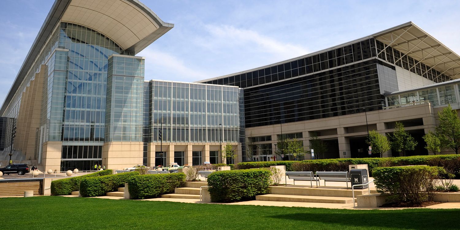 Modern convention center exterior with glass walls and curved architectural features shown in multiple panoramic views.