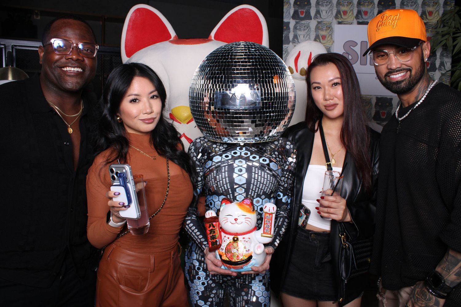 Group photo at a corporate event with Dell Technologies and AMD branding visible in the background.