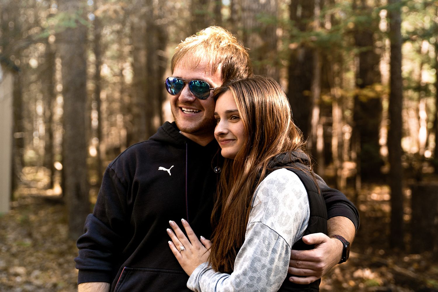 Surprise marriage proposal captured during a romantic engagement photoshoot.
