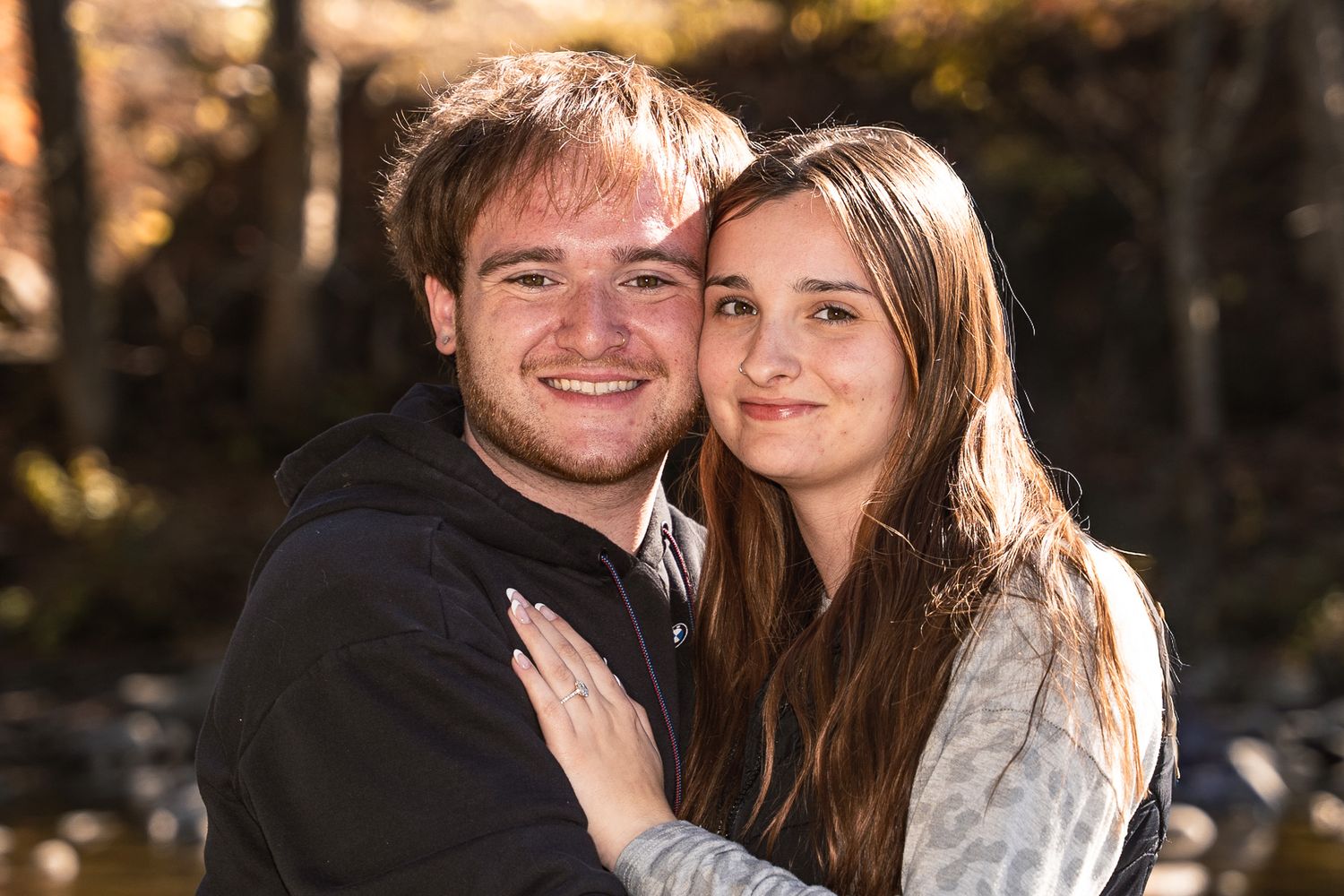 Surprise marriage proposal captured during a romantic engagement photoshoot.