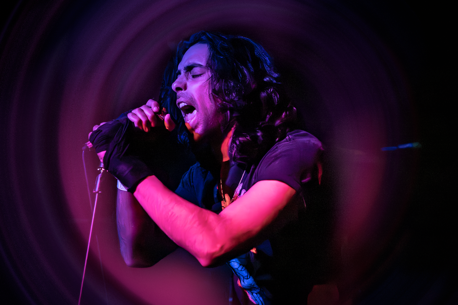 High-energy concert performance photographed in New England venue