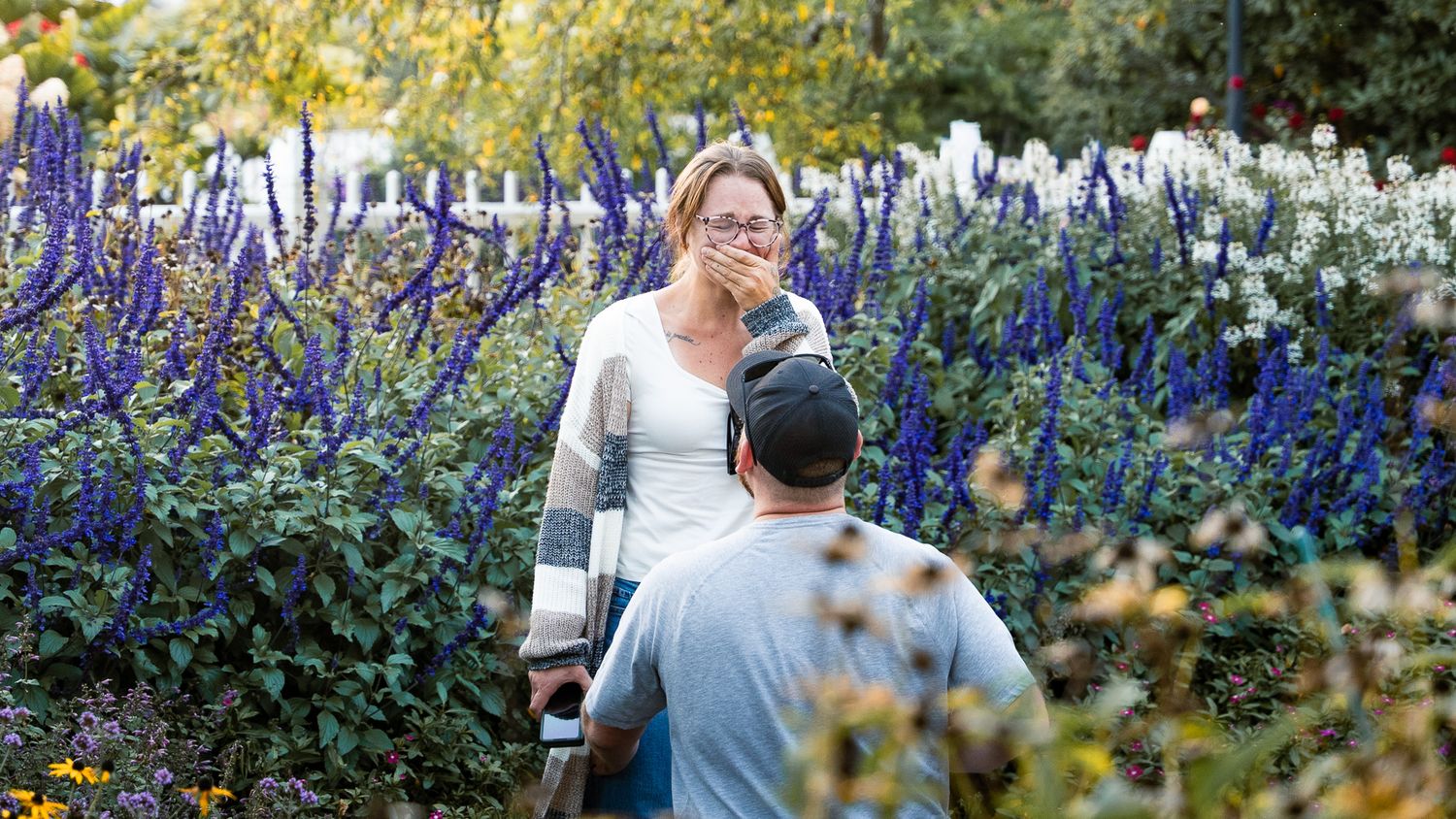 Surprise marriage proposal captured during a romantic engagement photoshoot.