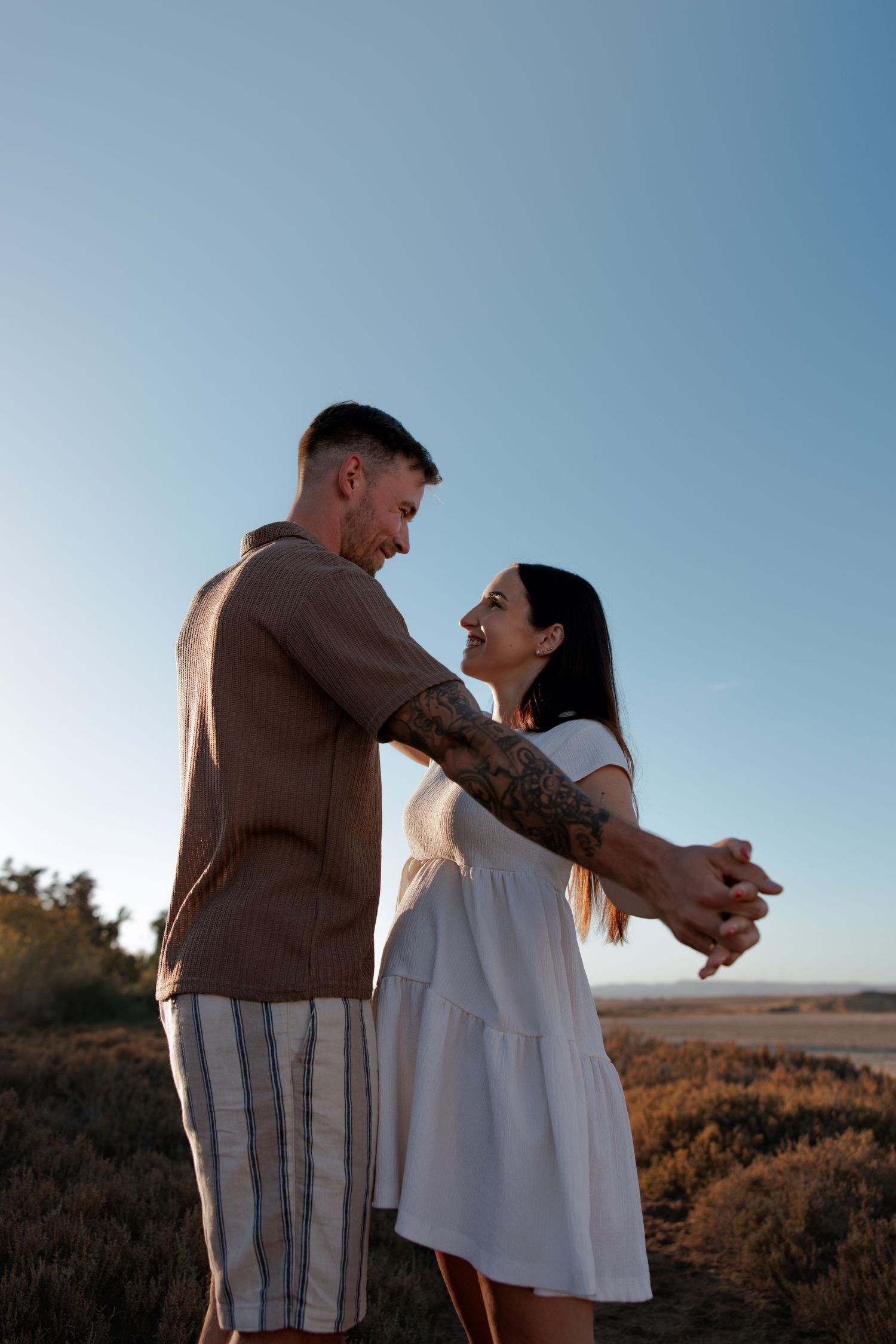 Couple embracing during a sunset maternity photoshoot in Cyprus