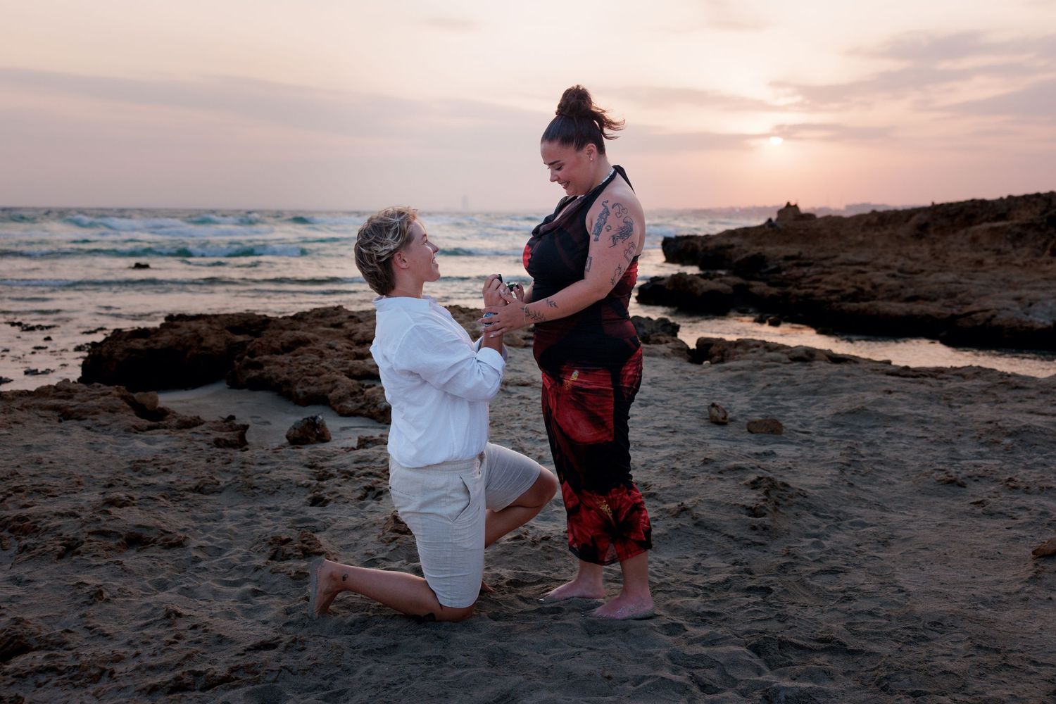 Couple during a sunset engagement photoshoot on a Cyprus beach