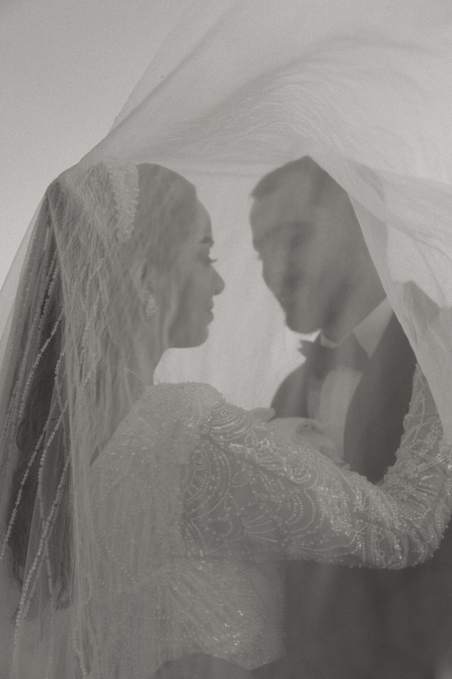 Soft black and white double-exposure style portrait of a couple during a Cyprus Wedding photoshoot