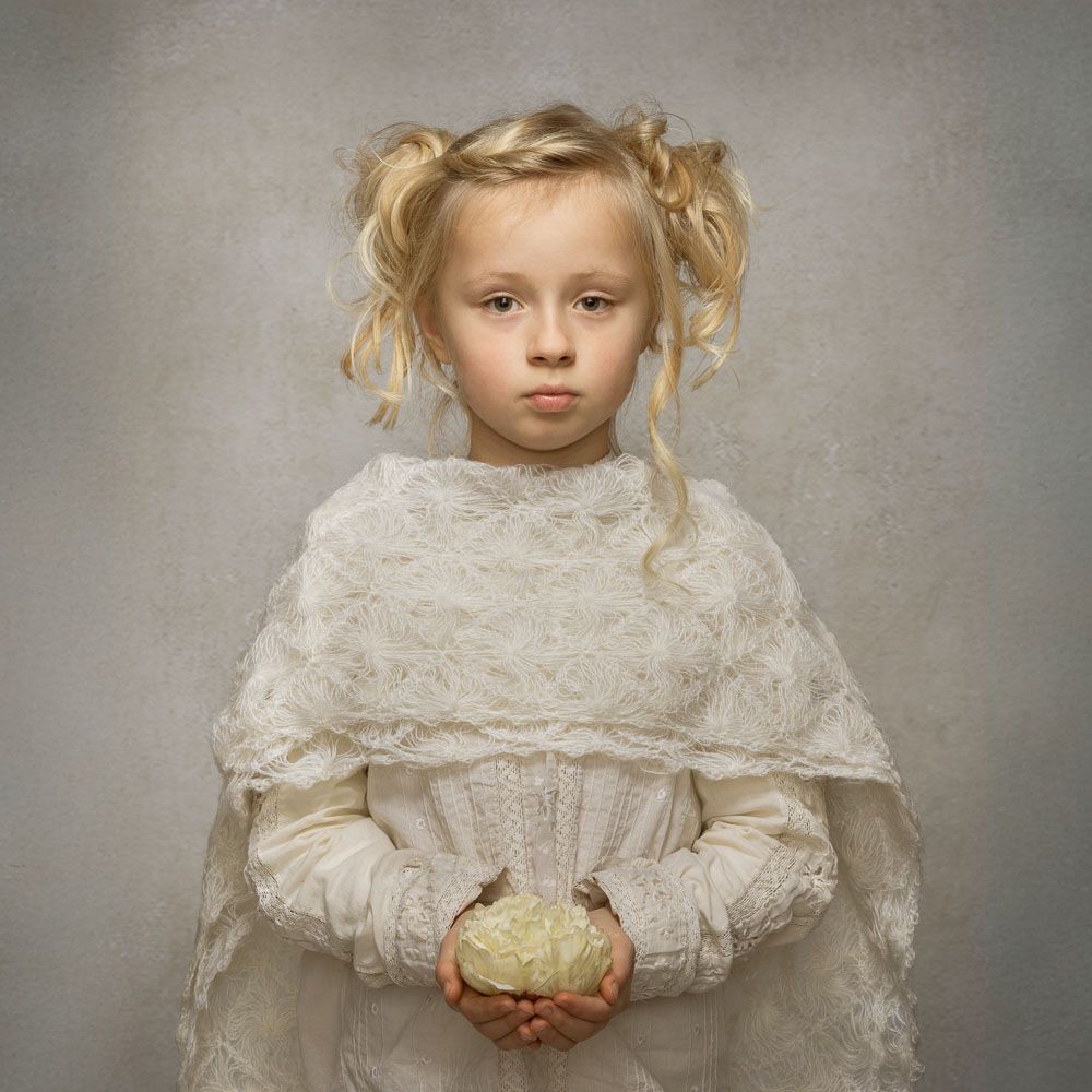 Fine art child portrait composed with controlled light in Kent
