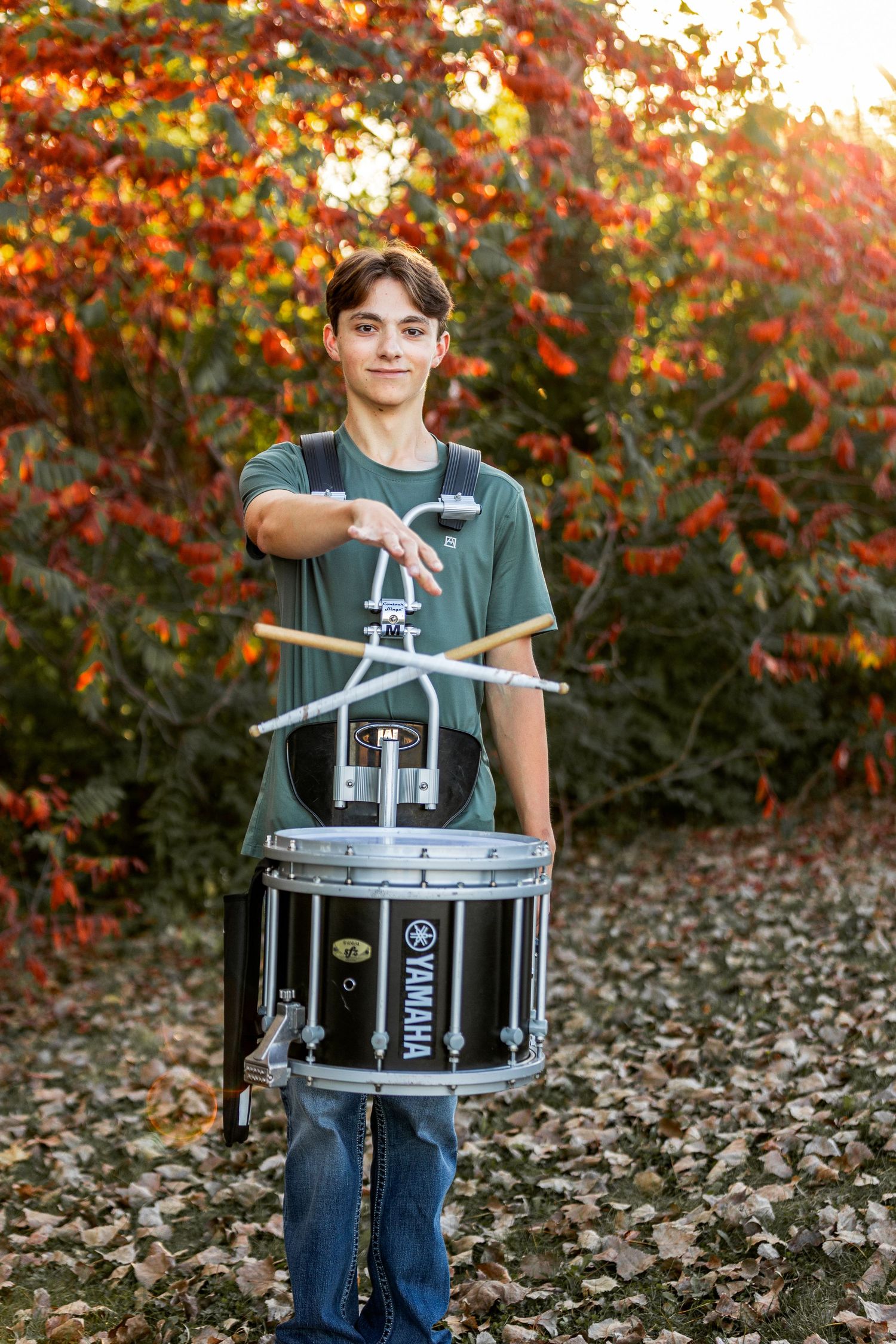 boy holding drum