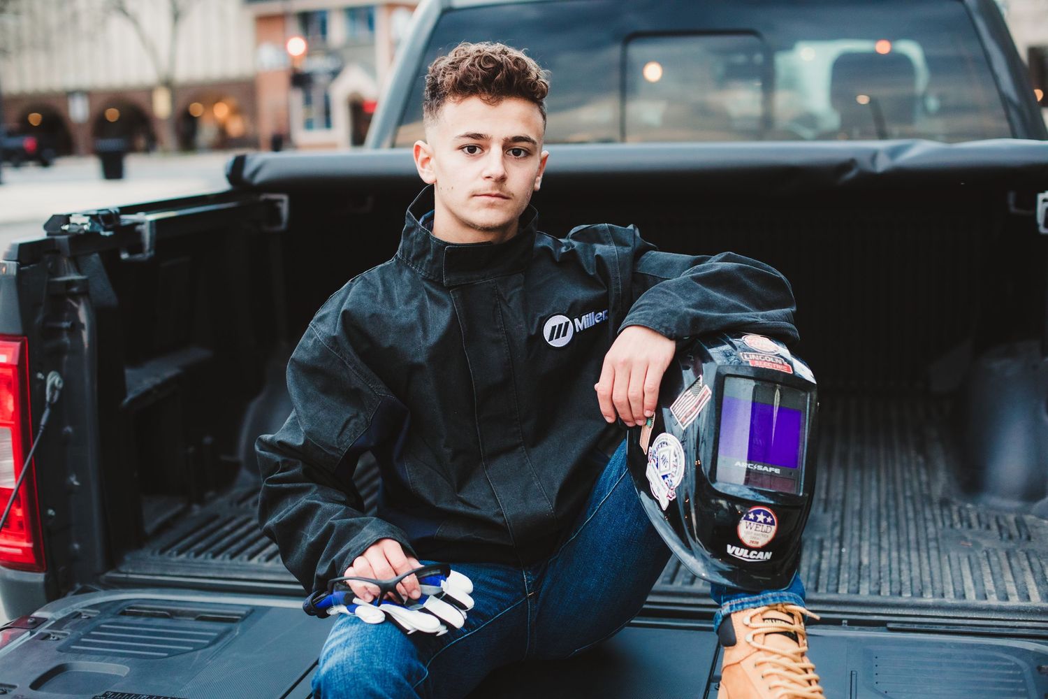 Stylish senior photo session featuring poses with a pickup truck.