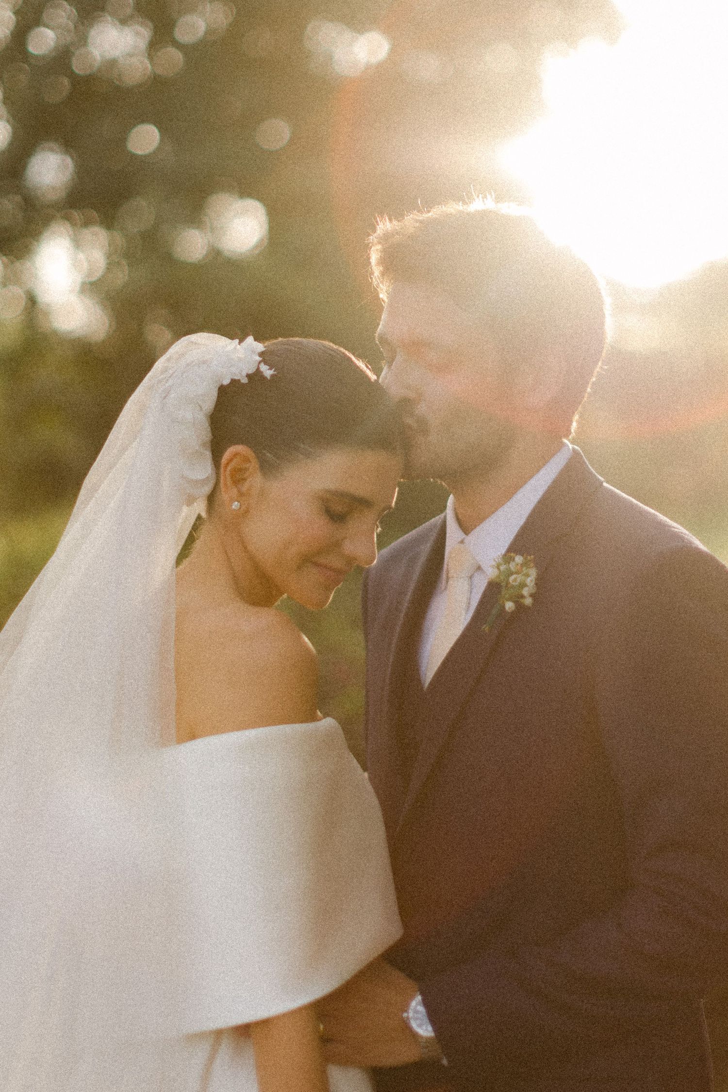 Romantic golden hour wedding photo series shows couple in elegant attire sharing intimate moments with soft bokeh lighting.