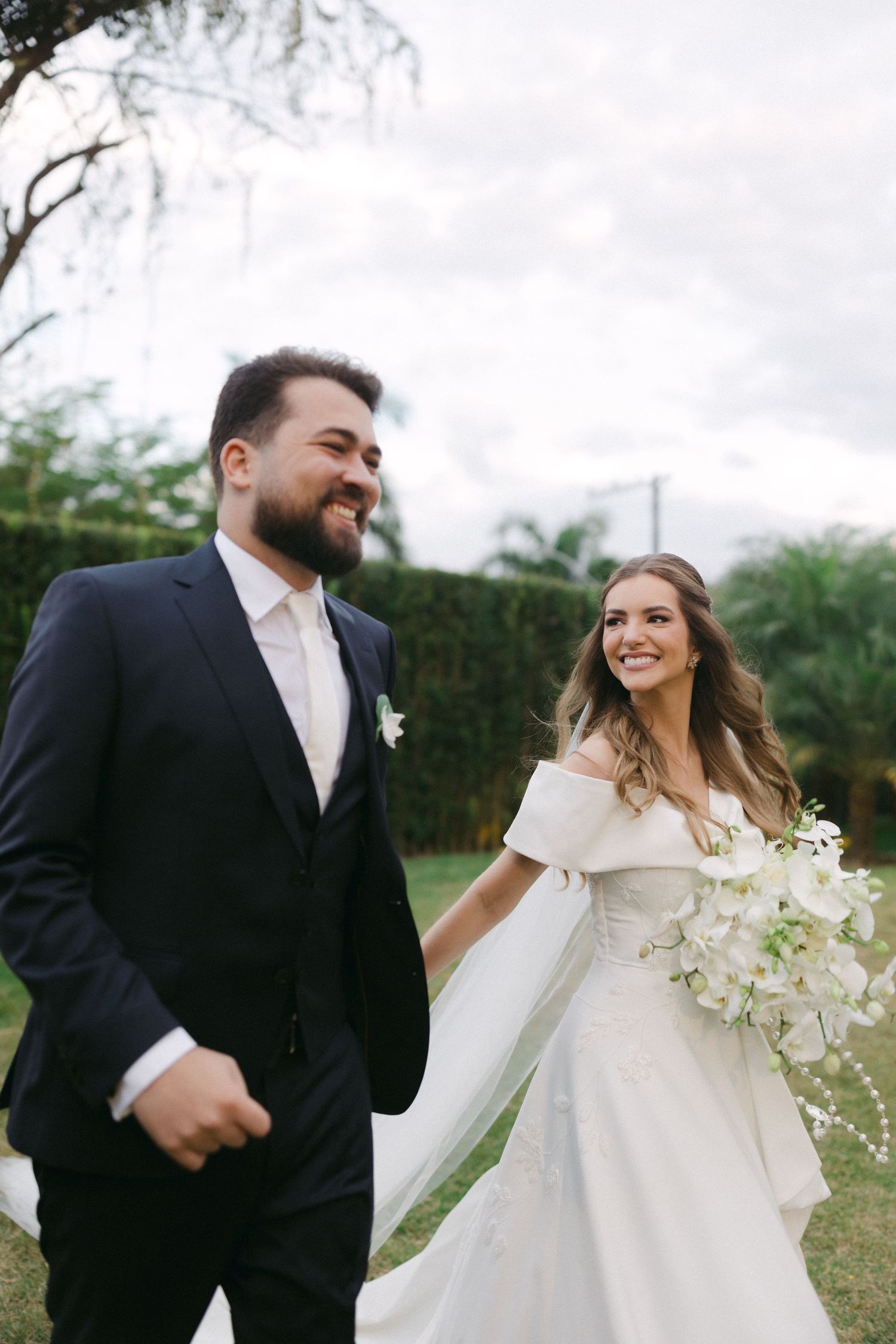A joyful moment captured between newlyweds showing five candid shots of their happy interaction outdoors.
