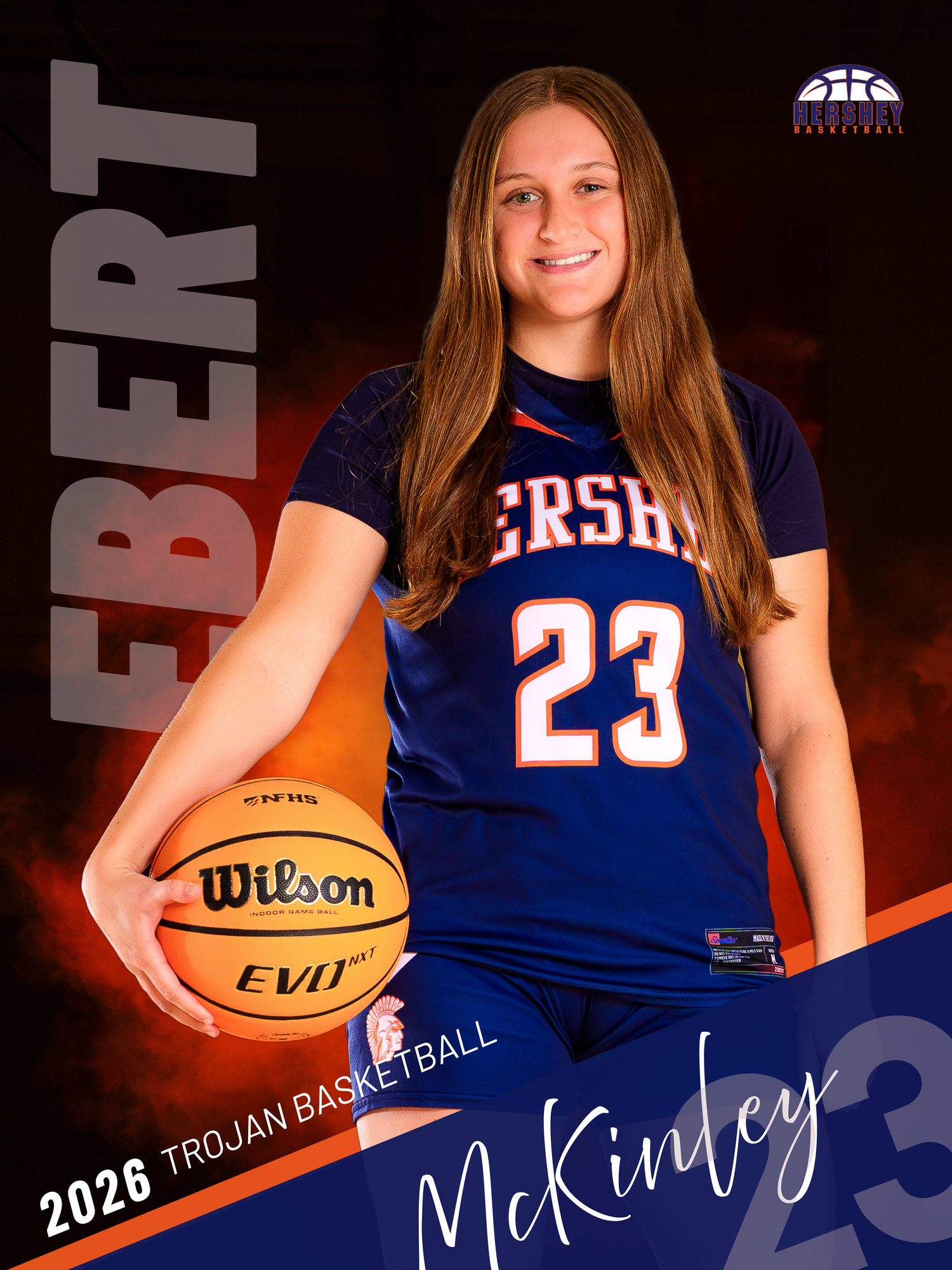 Hershey basketball senior banner, McKinley Ebert #23, class of 2026, blue jersey, holding basketball, SportsFox Photography