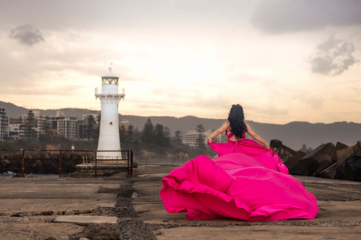 Creative coastal portrait in a flying dress photographed in Wollongong.