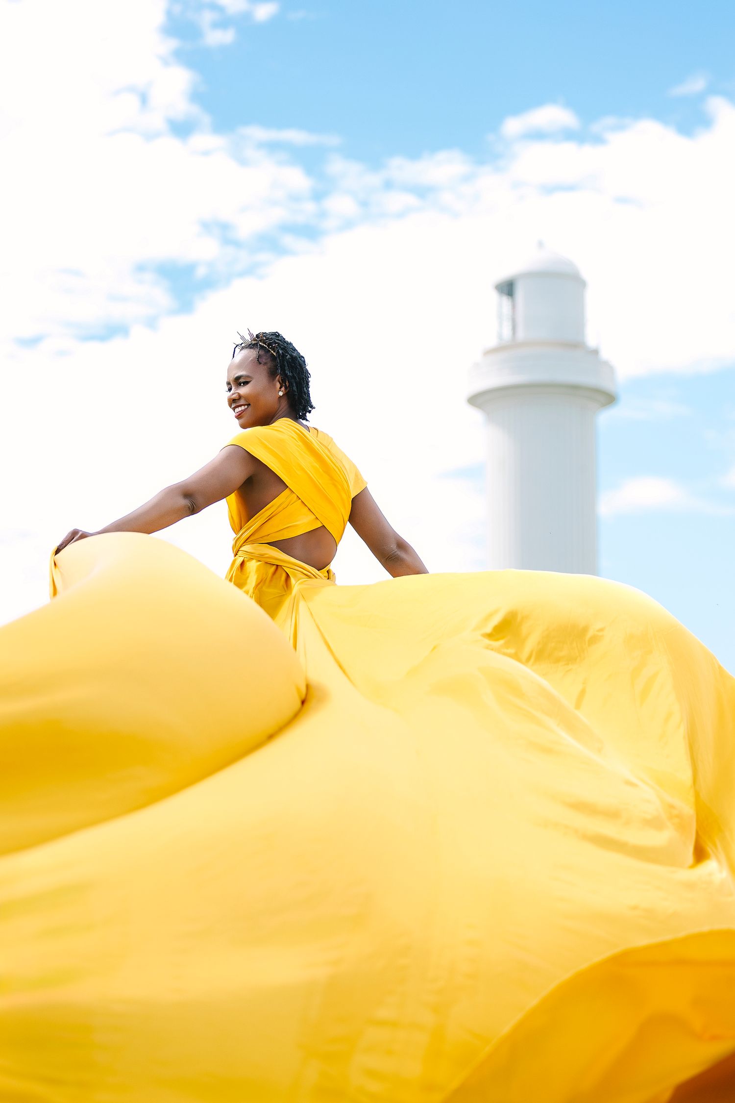 Creative coastal portrait in a flying dress photographed in Wollongong.