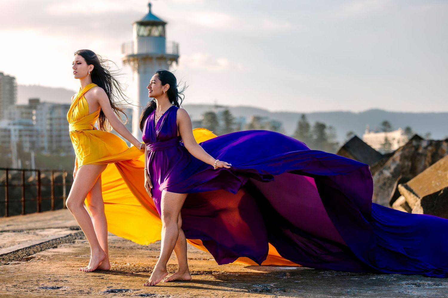 Creative coastal portrait in a flying dress photographed in Wollongong.