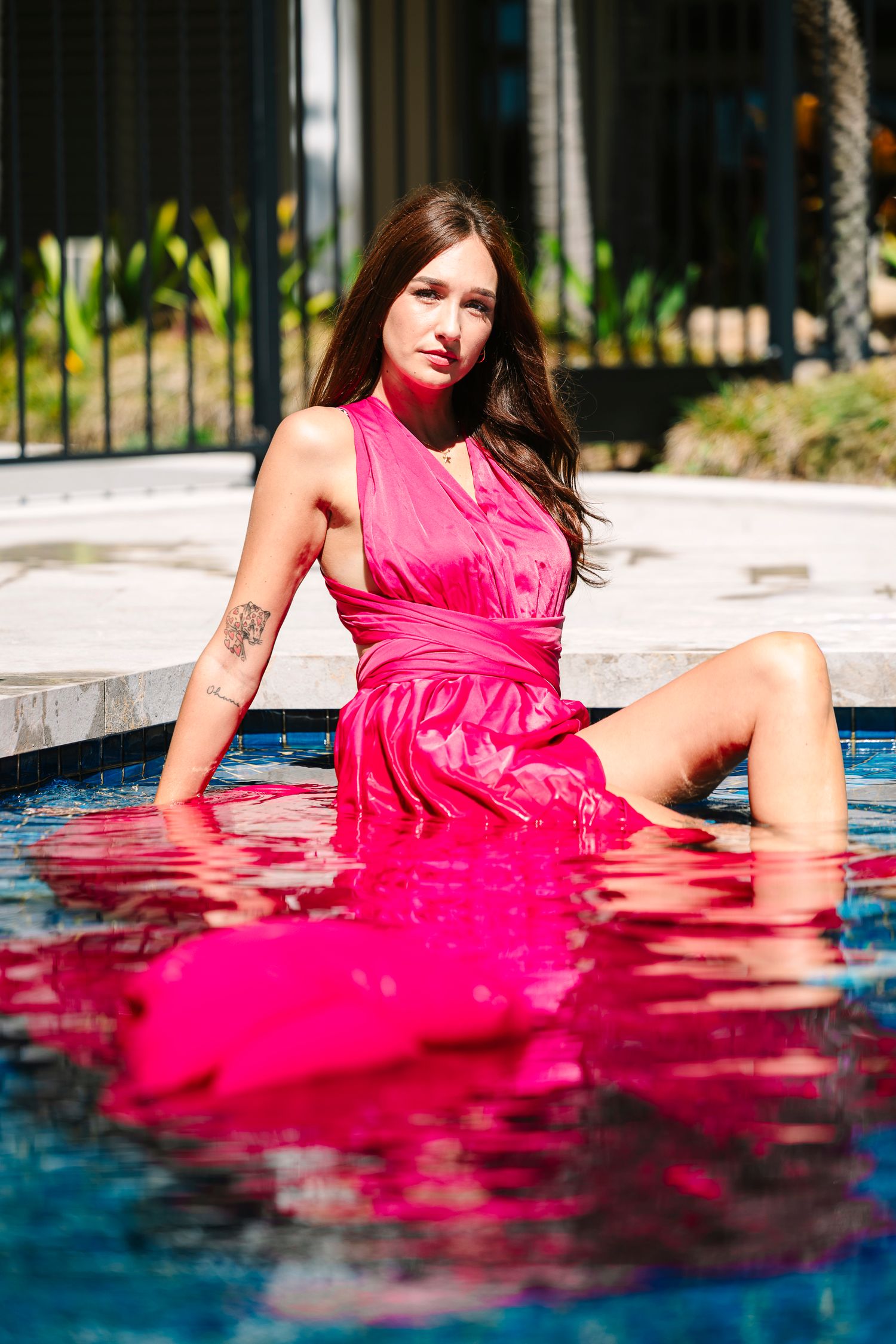 Wollongong Flying Dress Photographer. Woman in a pink Flying Dress in a pool.