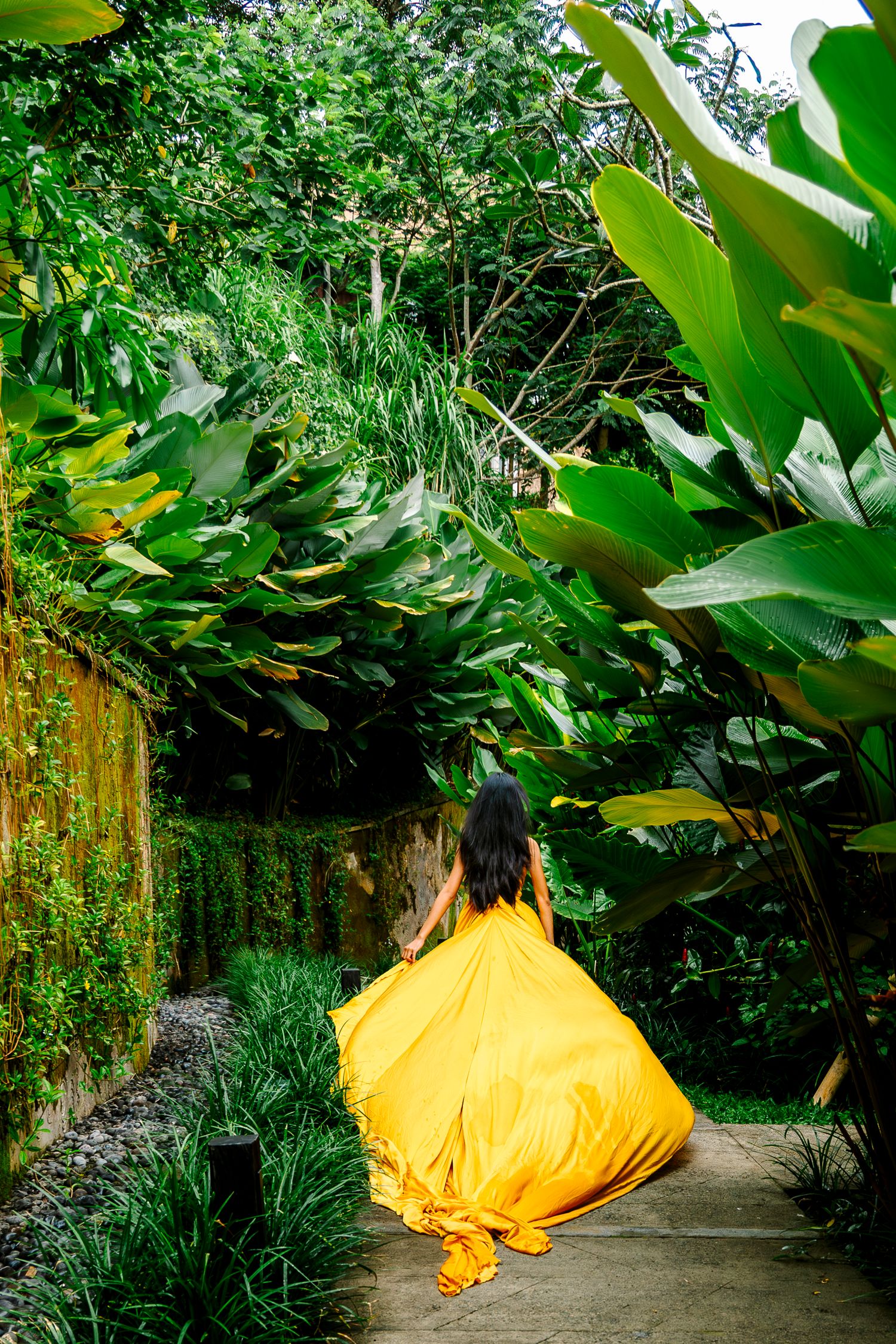 Wollongong Flying Dress Photographer. Girl in yellow Flying Dress running at Akohara Resort Bali.