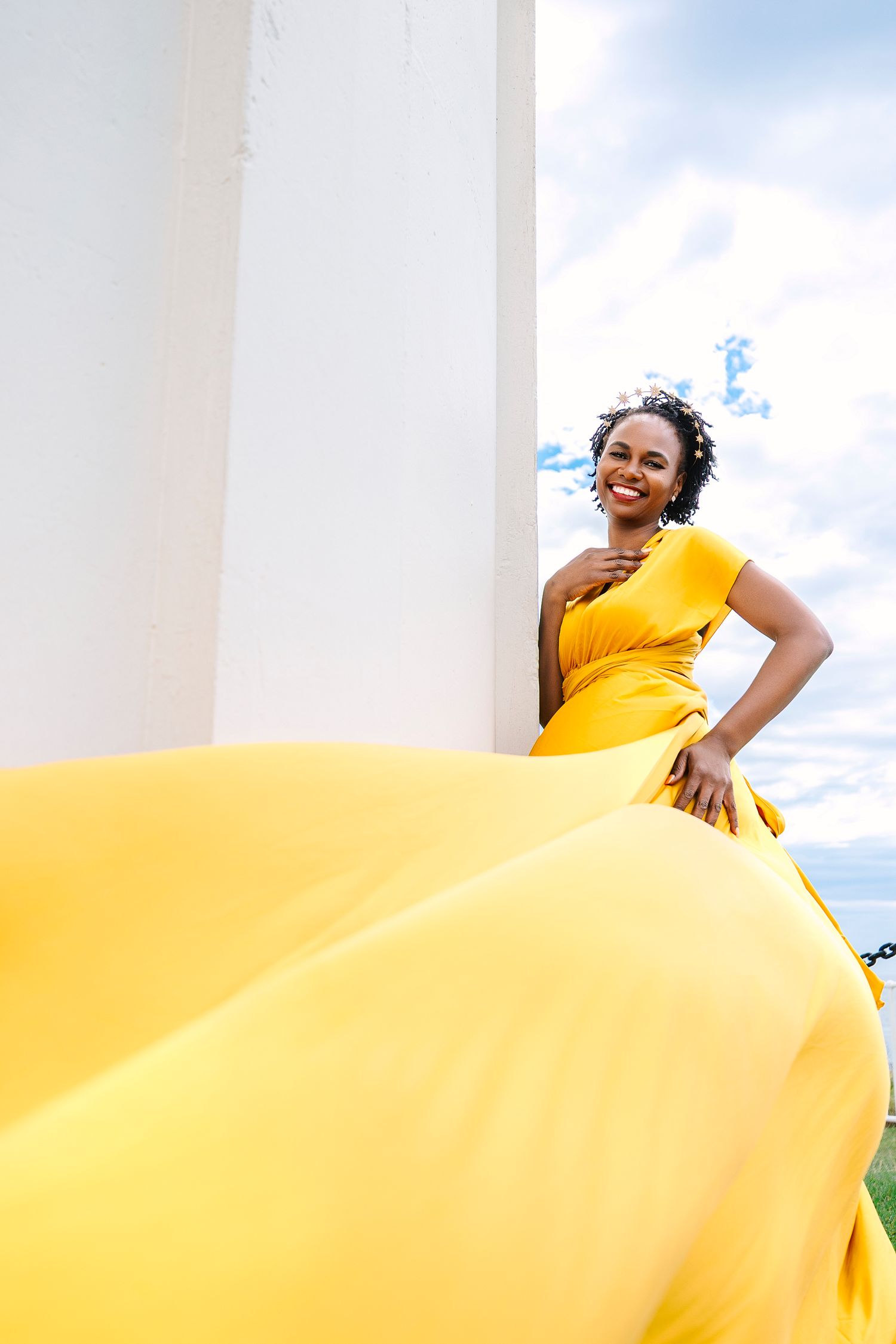 Creative coastal portrait in a flying dress photographed in Wollongong.