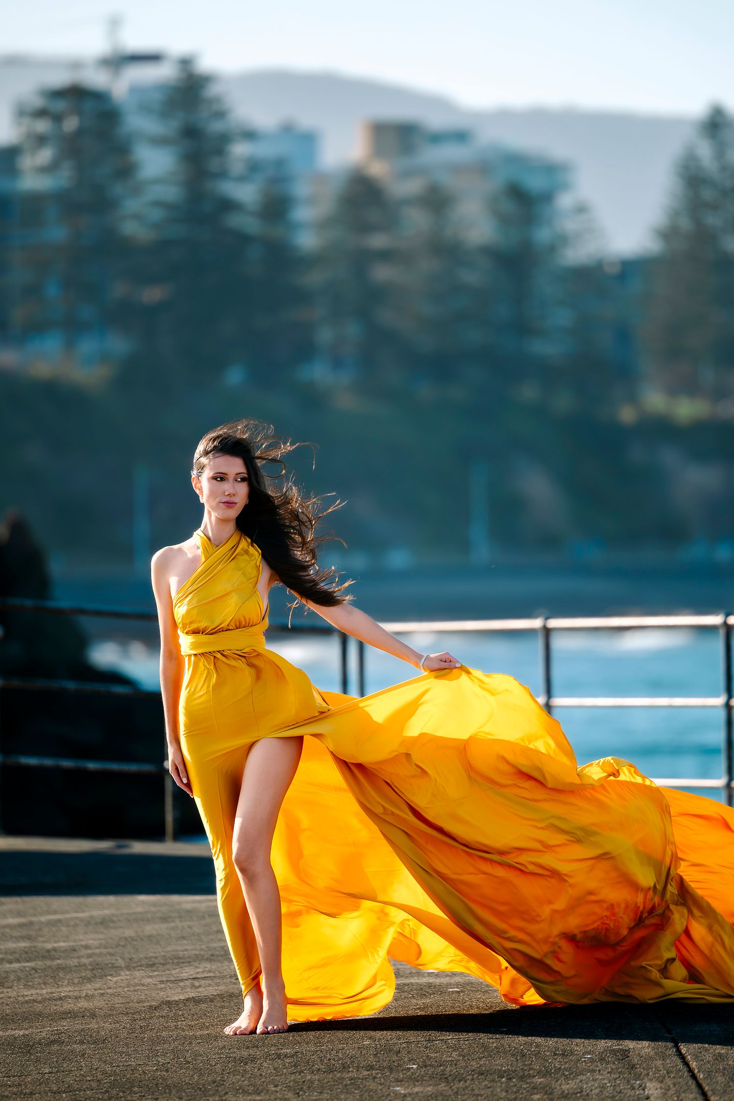 Creative coastal portrait in a flying dress photographed in Wollongong.