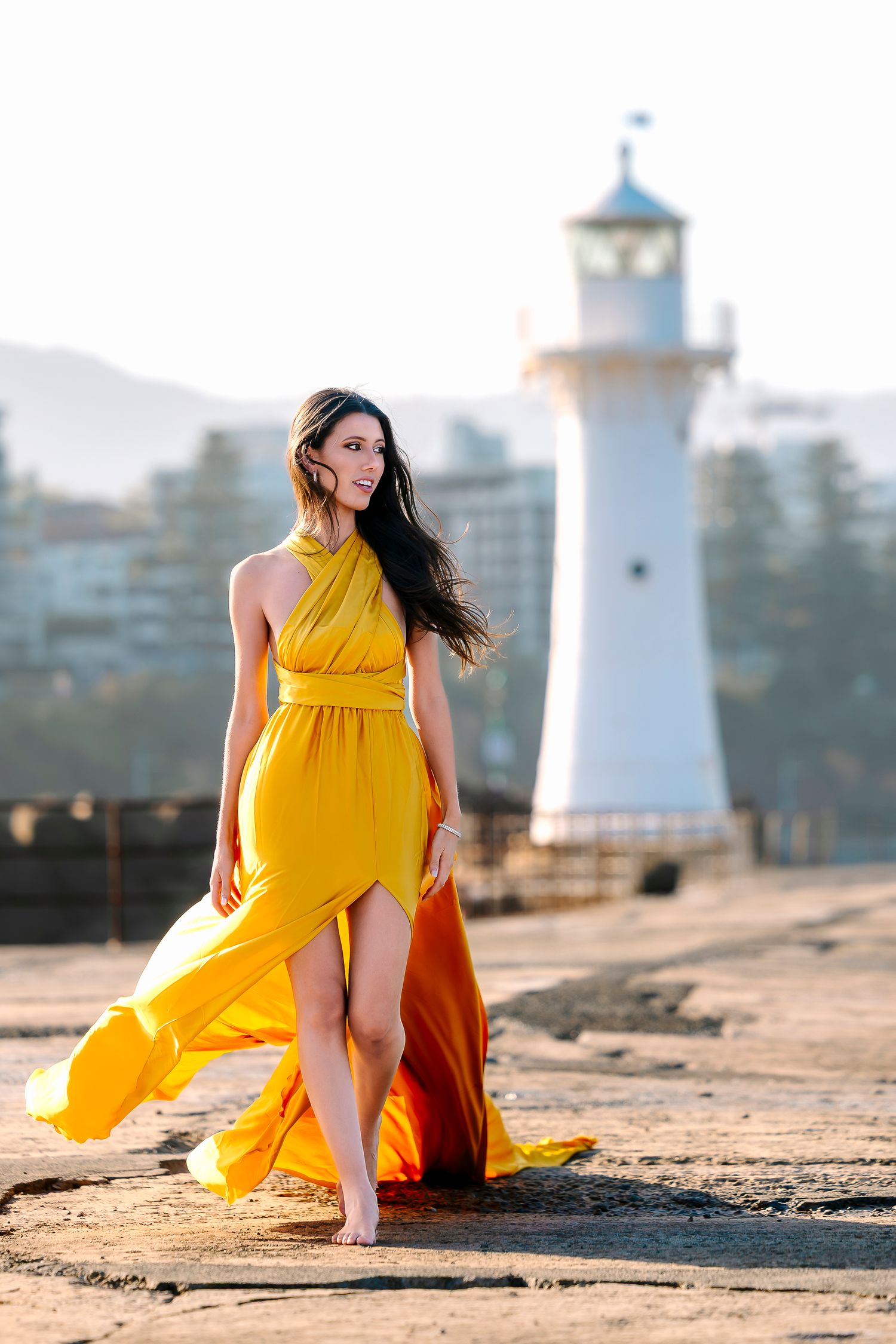 Creative coastal portrait in a flying dress photographed in Wollongong.