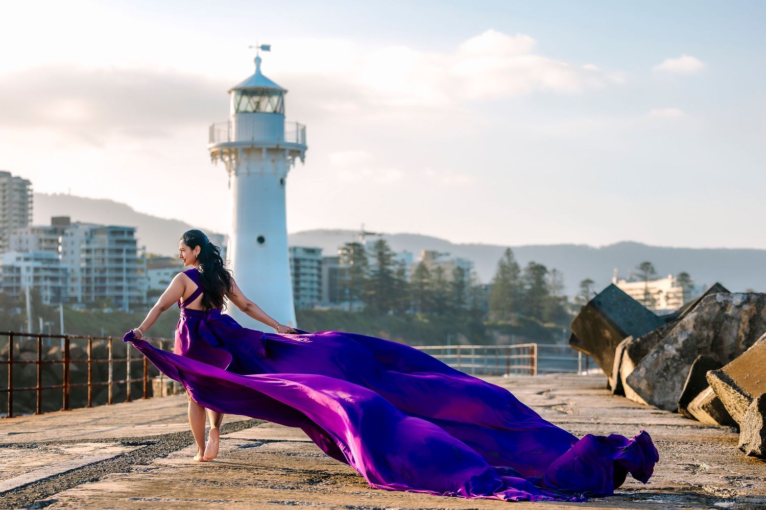 Creative coastal portrait in a flying dress photographed in Wollongong.