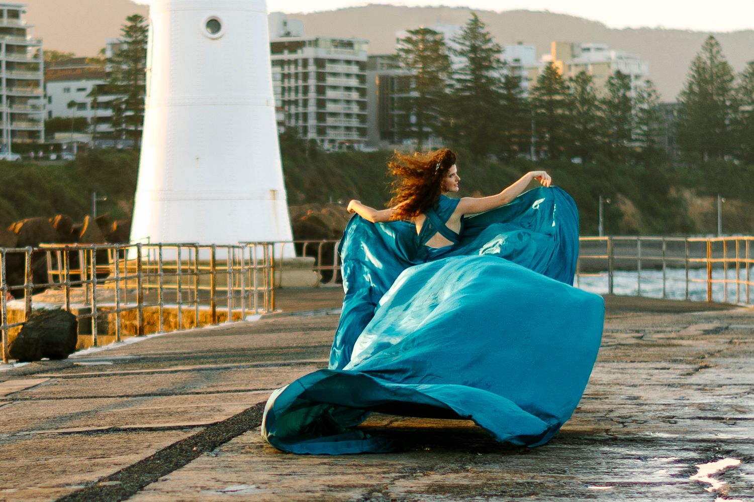 Wollongong Flying Dress Photographer. Woman in Flying Dress at Wollongong Breakwater Lighthouse