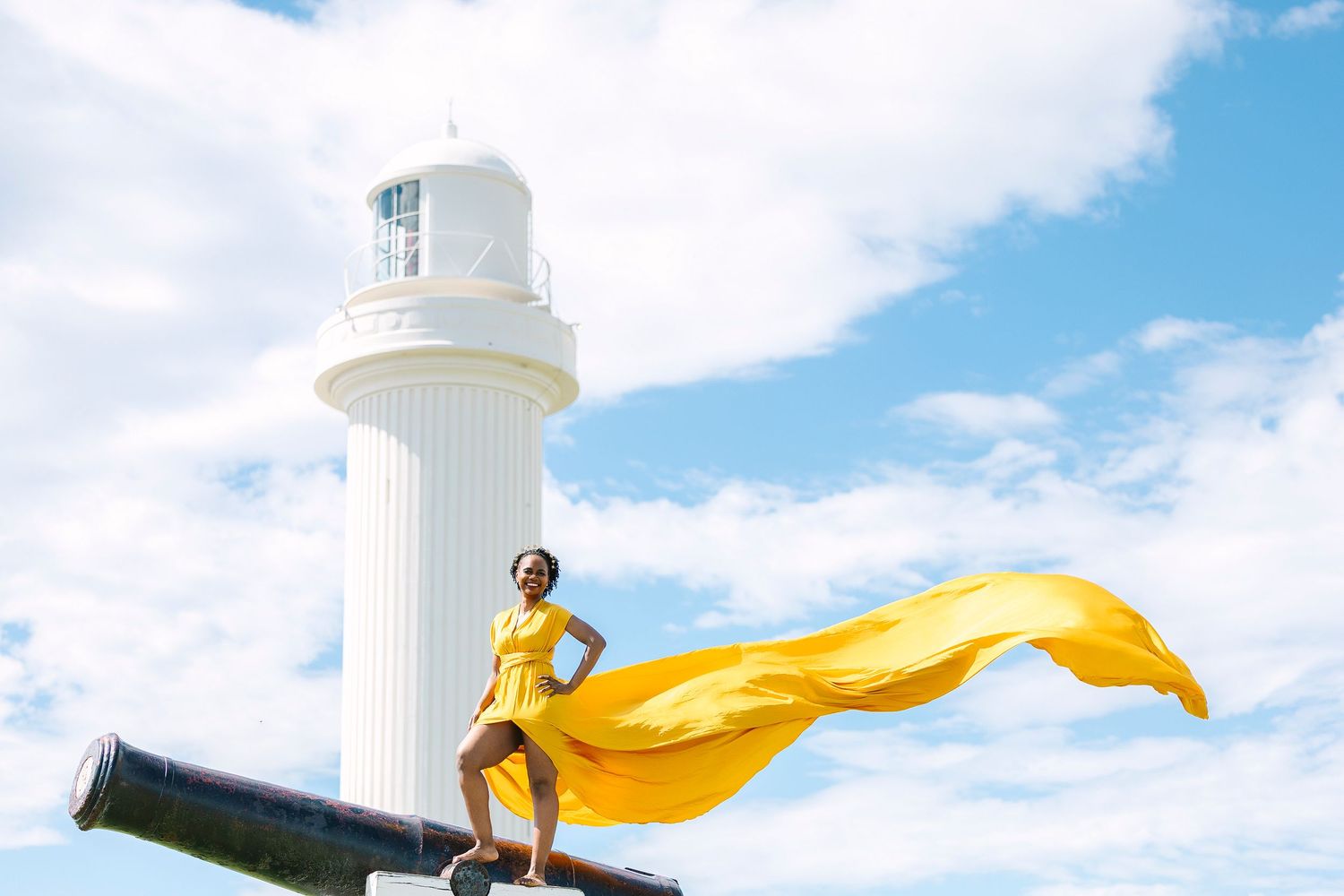 Creative coastal portrait in a flying dress photographed in Wollongong.