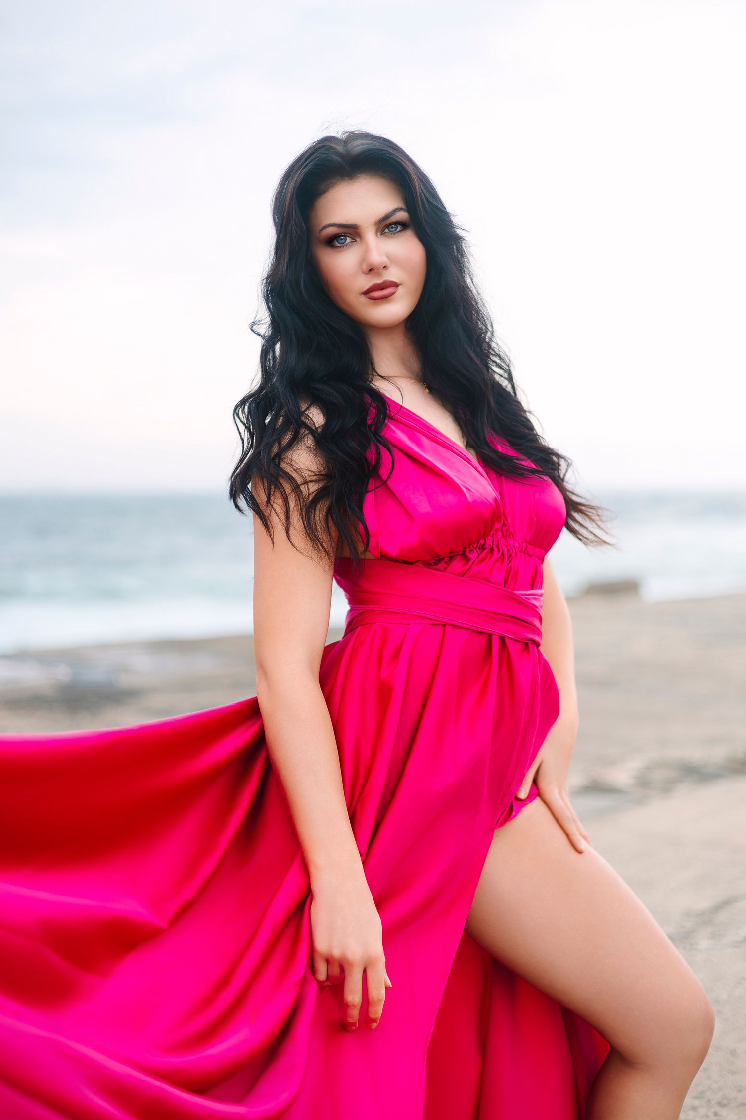 Creative coastal portrait in a flying dress photographed in Wollongong by photographer Angelique Kelly.